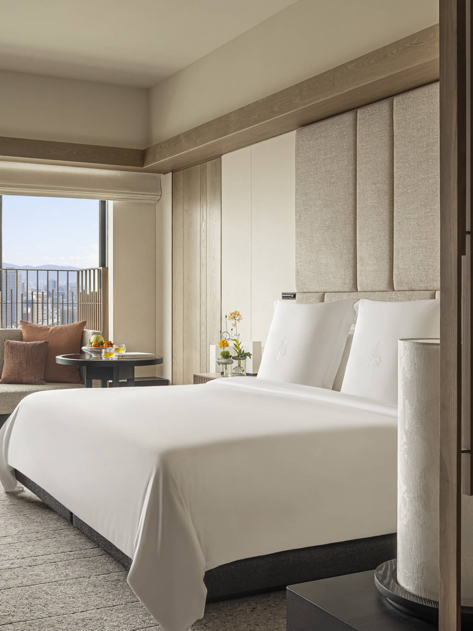Hotel room with king bed and Osaka city view