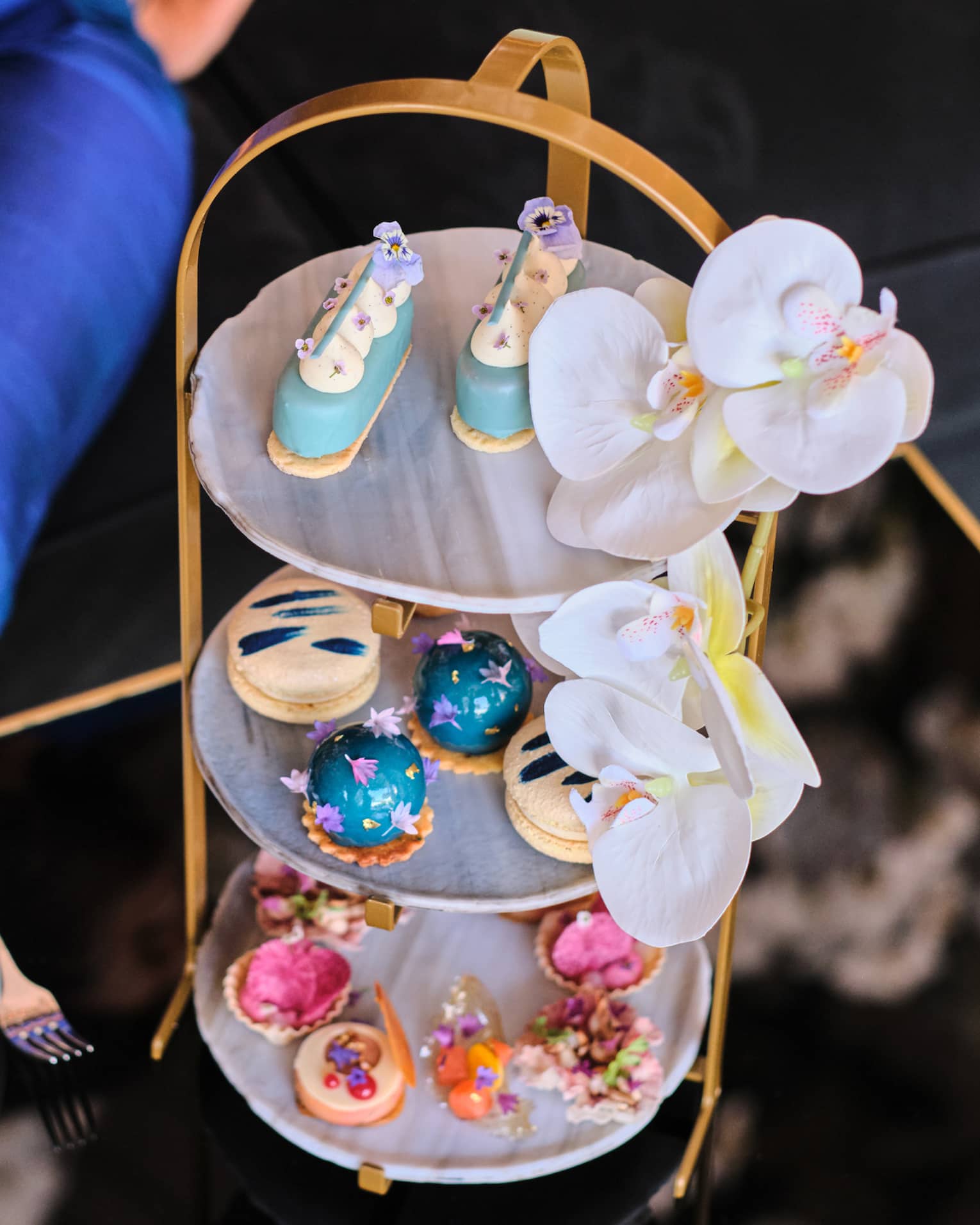 An afternoon tea set with colourful pastries.