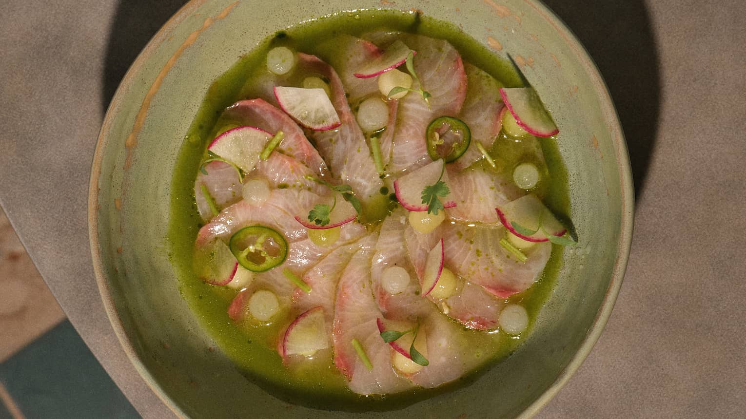 Seafood ceviche in a light-green bowl