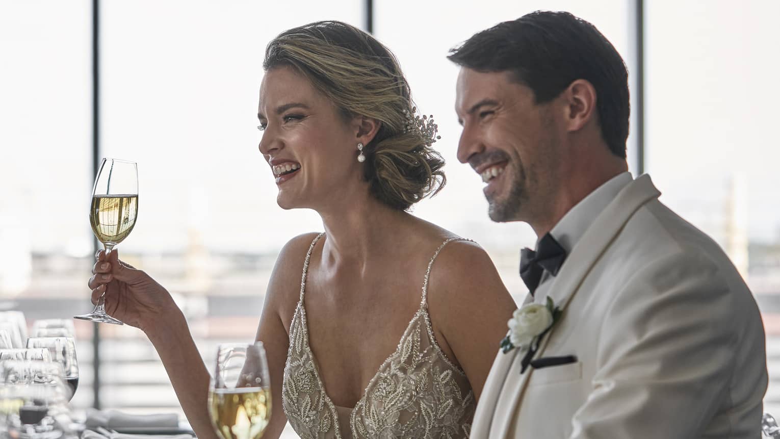 A man and woman at a wedding.