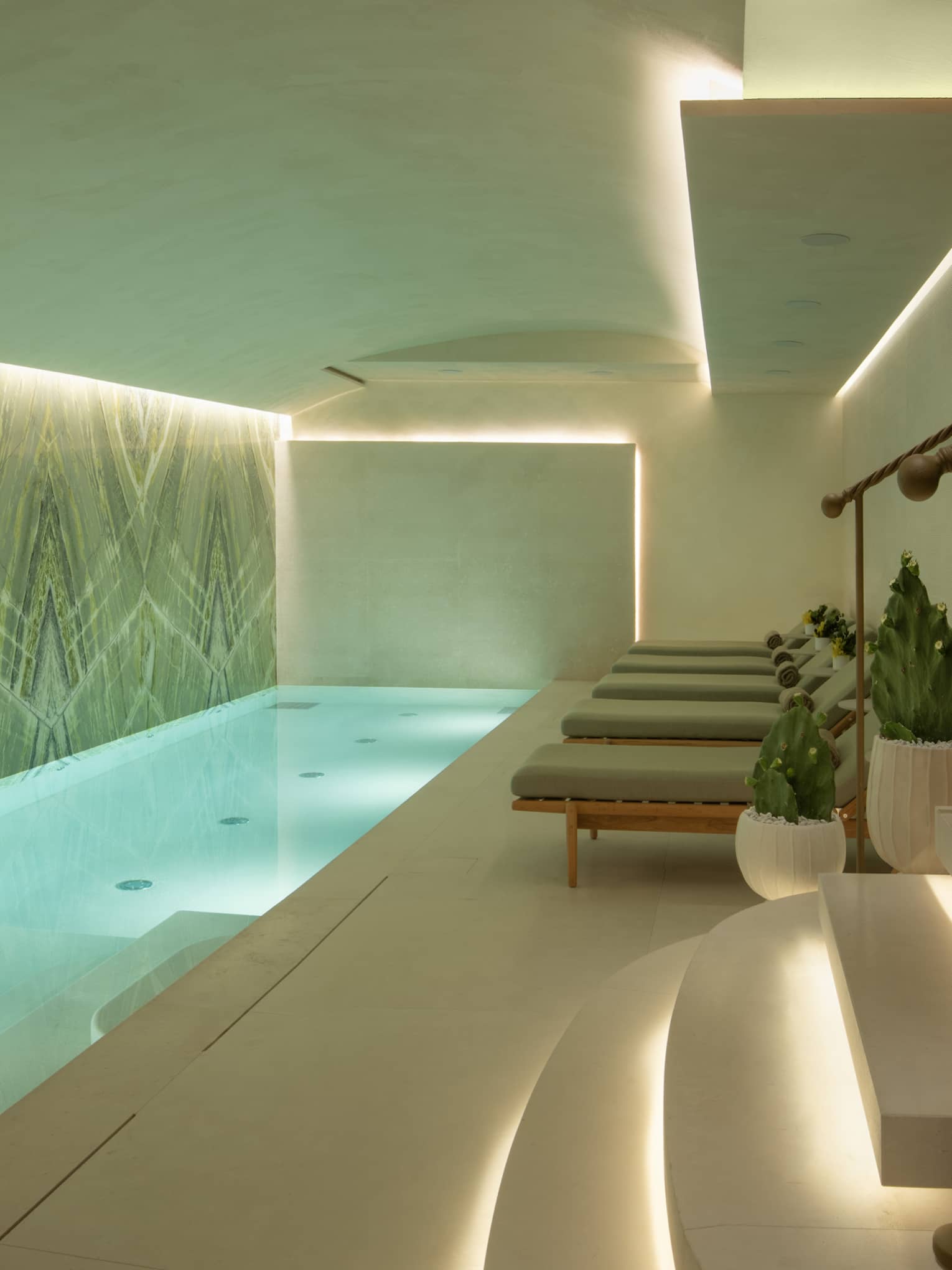 Spa pool area with lounge chairs