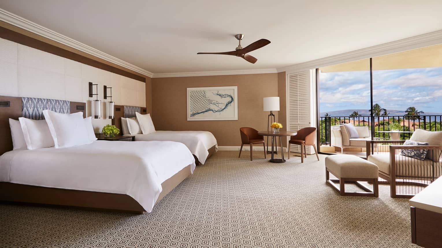Bright Club Ocean-View Room bed with two-seat dining table, armchair and lanais with ocean view