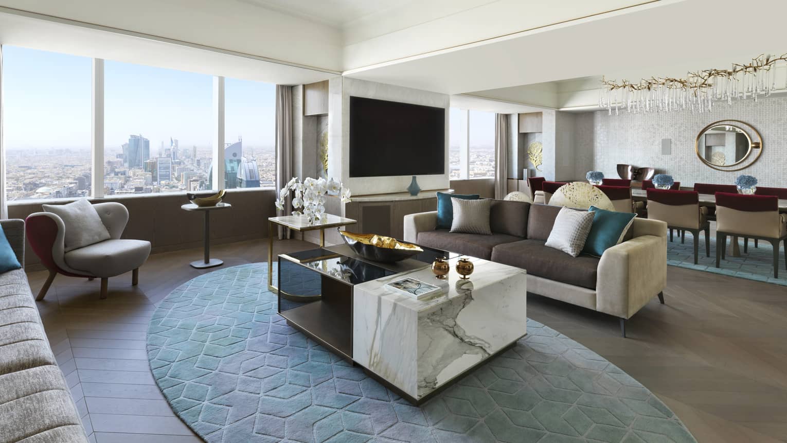 Living room with large marble coffee table, two sofas, arm chair, windows