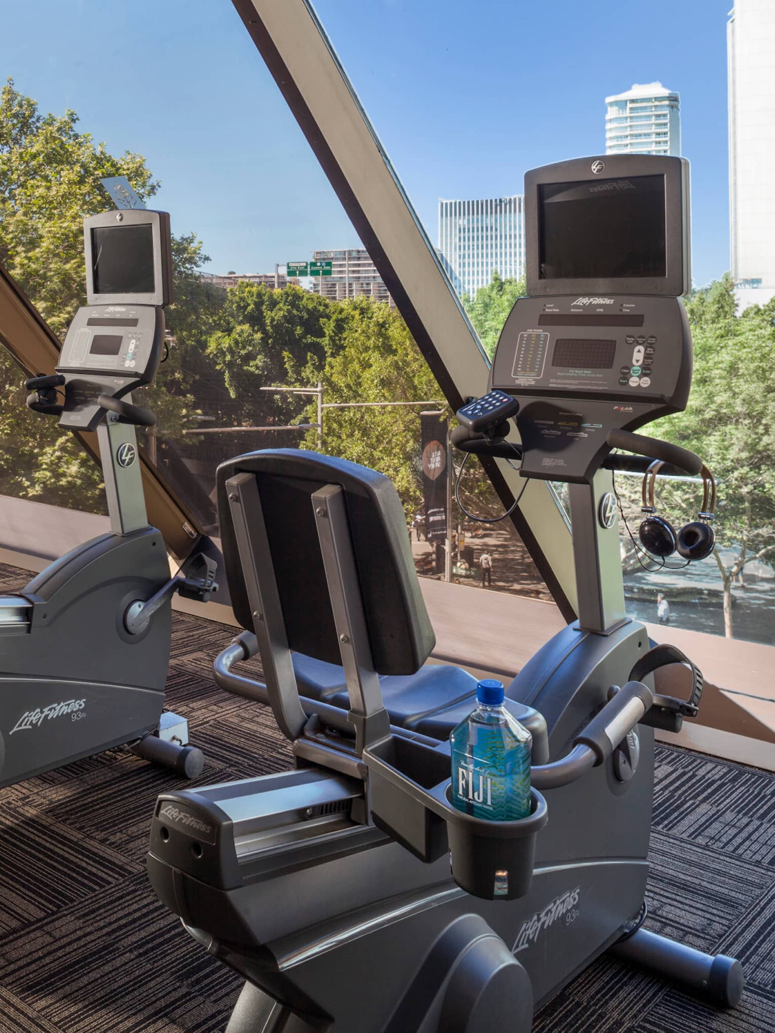 Cardio bikes, machines lined up by window in Fitness Centre