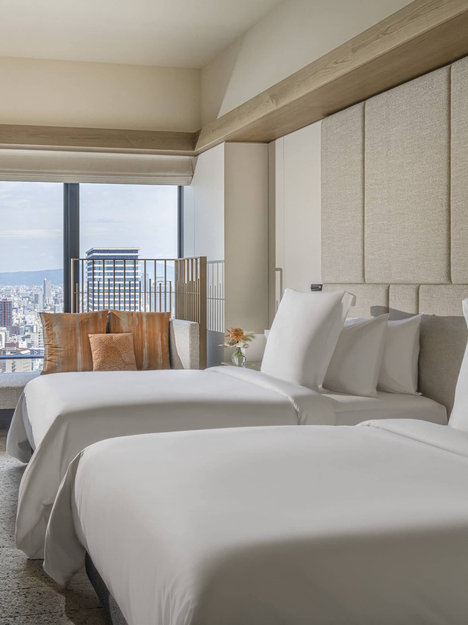 Hotel room with two single beds and Osaka city view