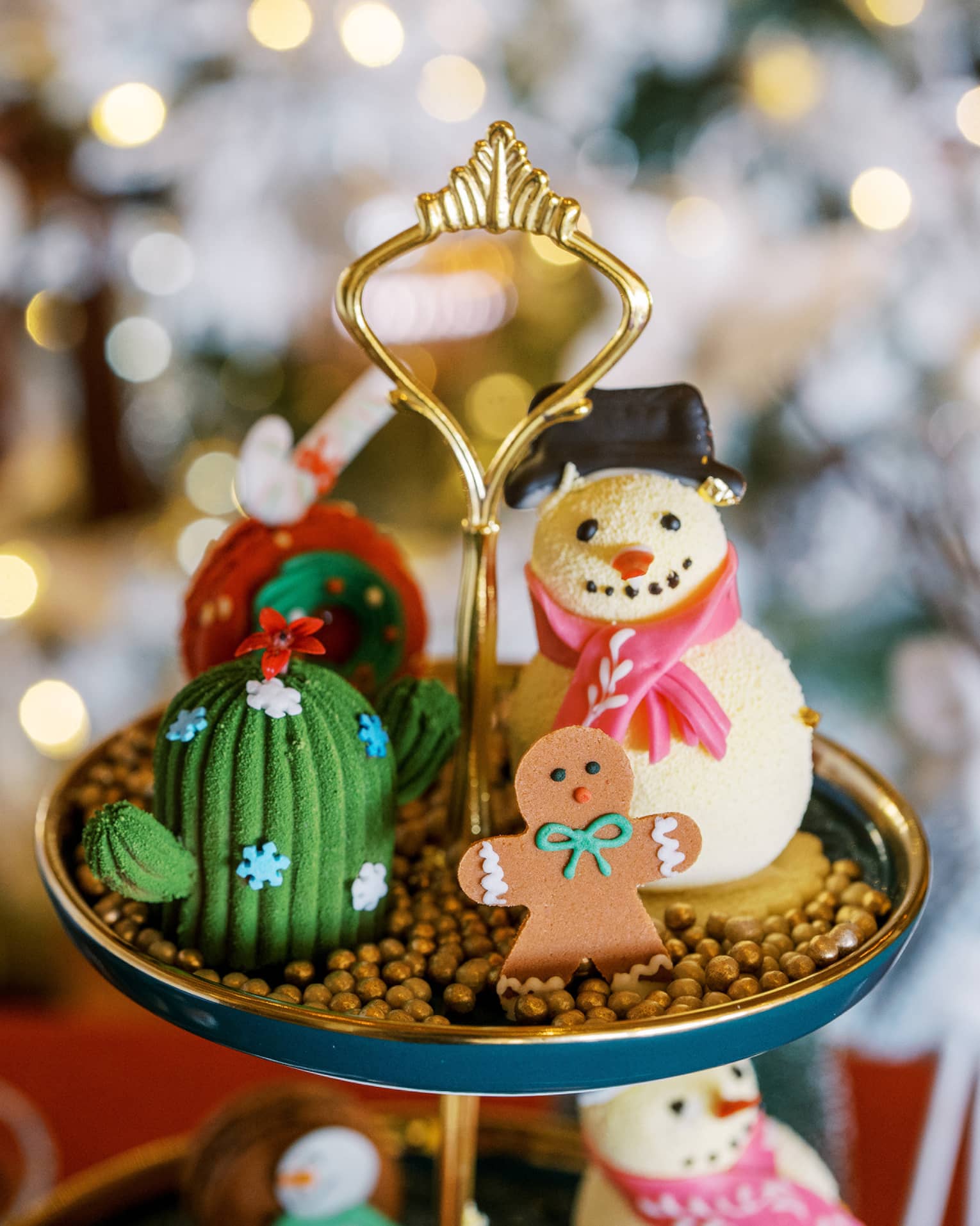 A display with a snowman and gingerbread man and lights in the background