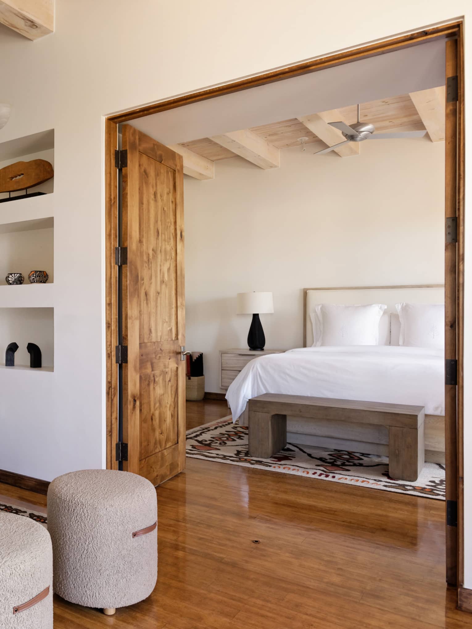 Hotel suite with bedroom and separate sitting area at Four Seasons Resort Santa Fe