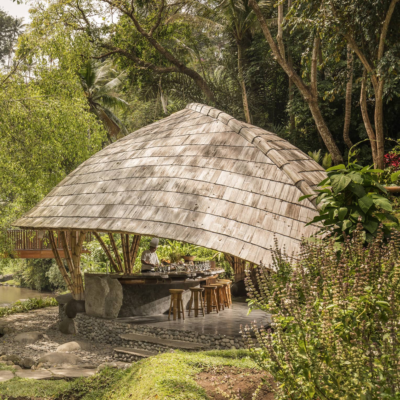 Four Seasons guests attend Sokasi Cooking School in an outdoor pavillion