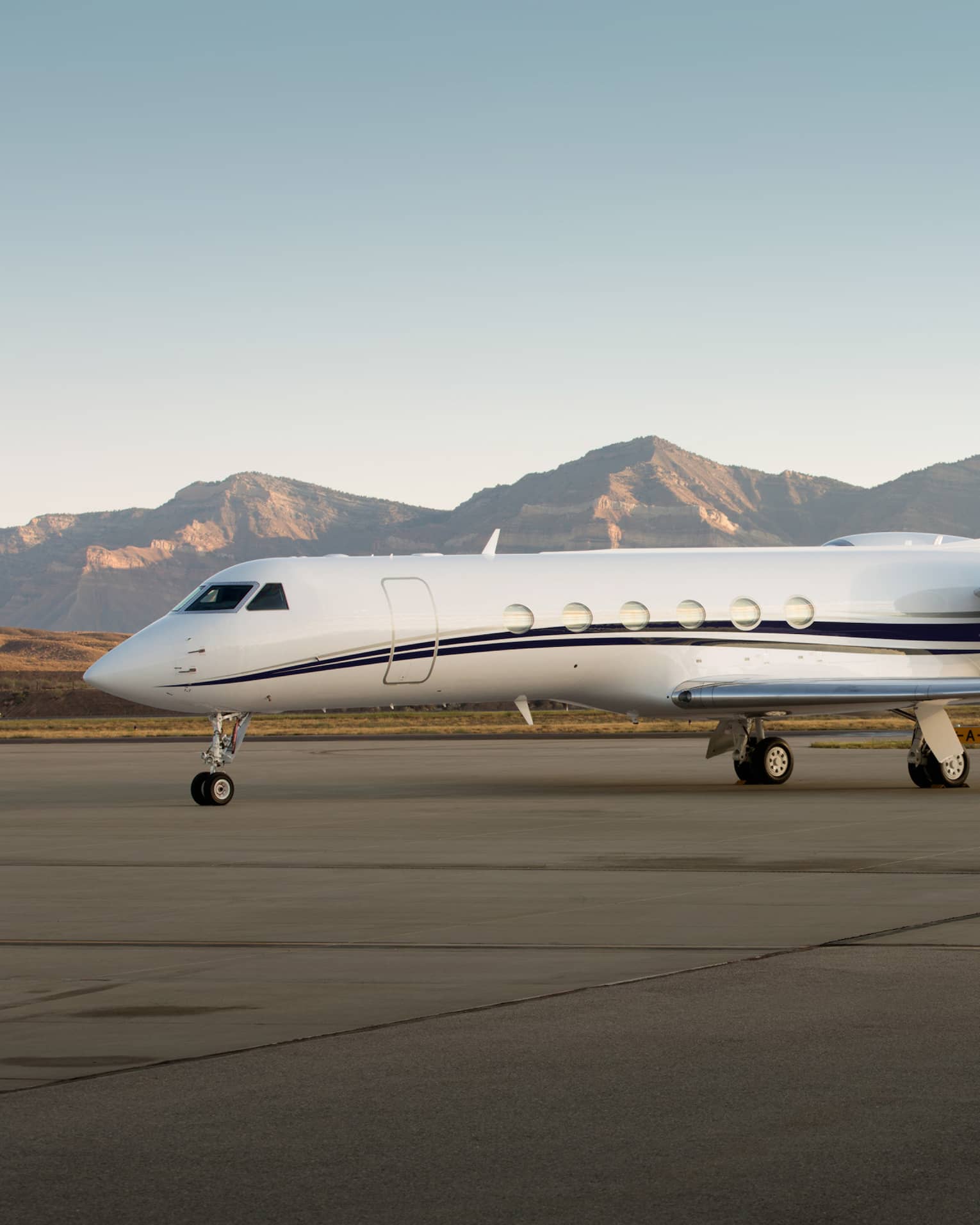 Jet Edge private jet parked on airport runway