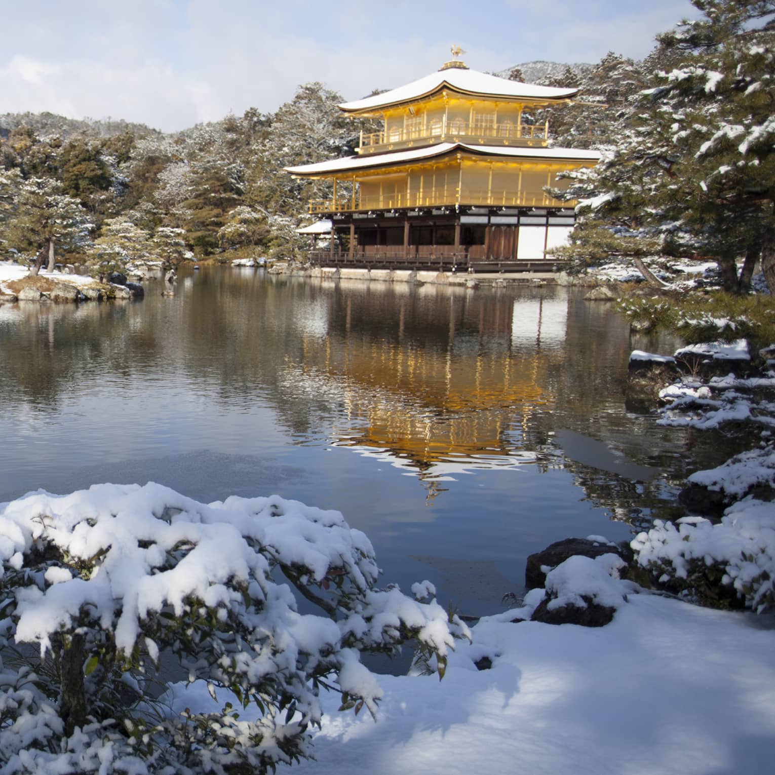 Golden Temple in Kyoto Japan covered with snow by the lake