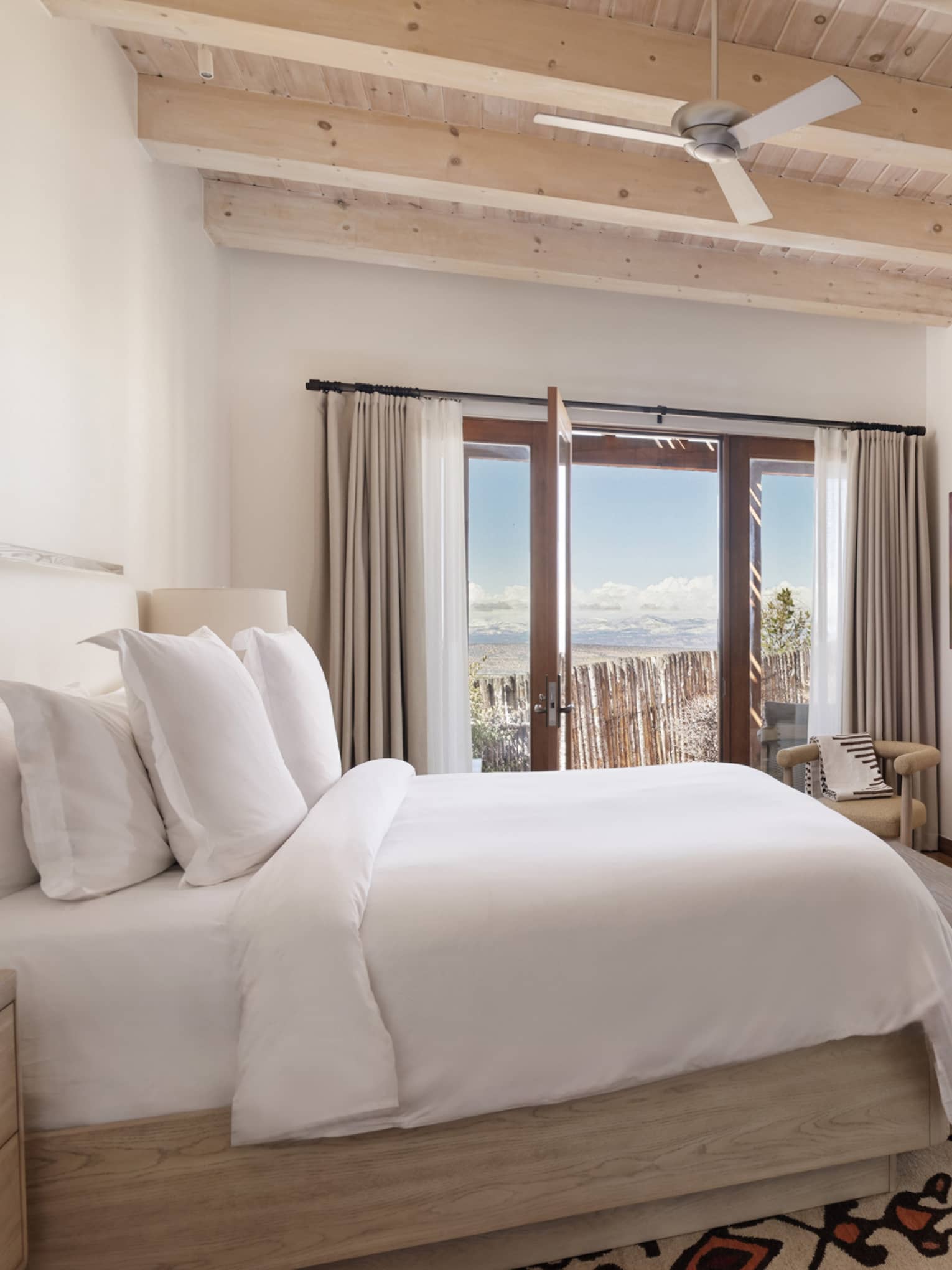 Suite bedroom with king bed at Four Seasons Resort Santa Fe