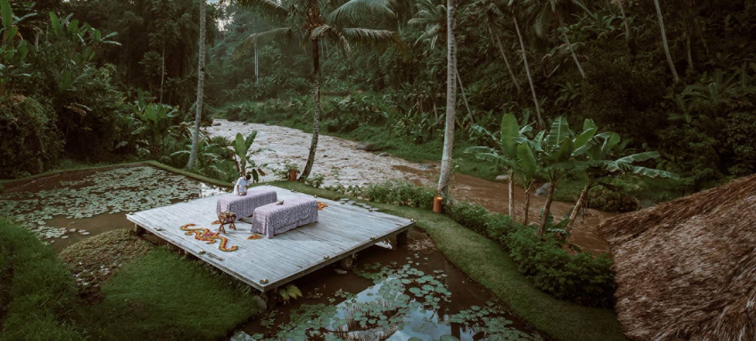 A nighttime spa treatment next to a river in Bali