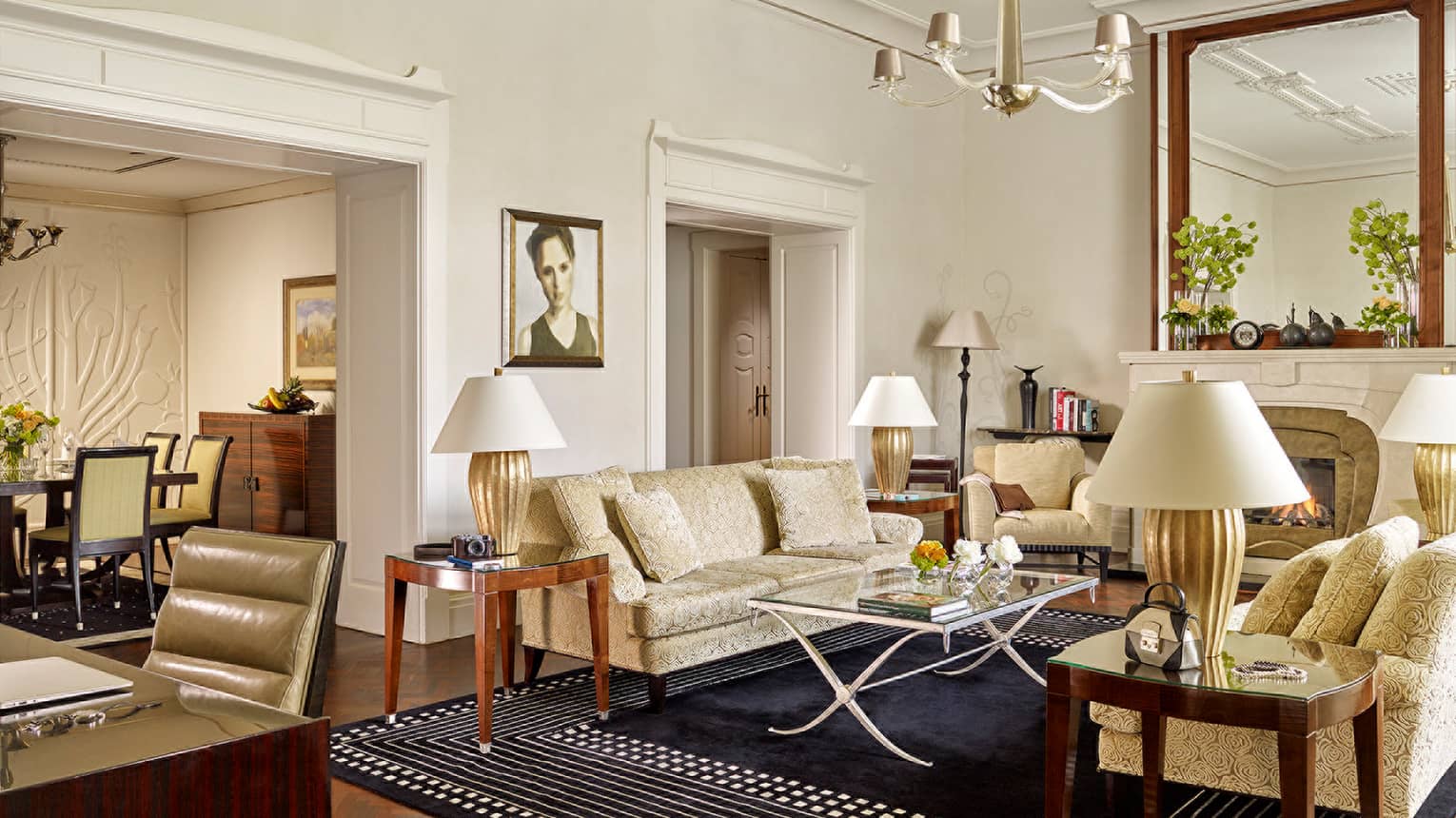Buda Castle Presidential Suite with ivory velvet sofas, living room and work area, dining room, gold accents throughout