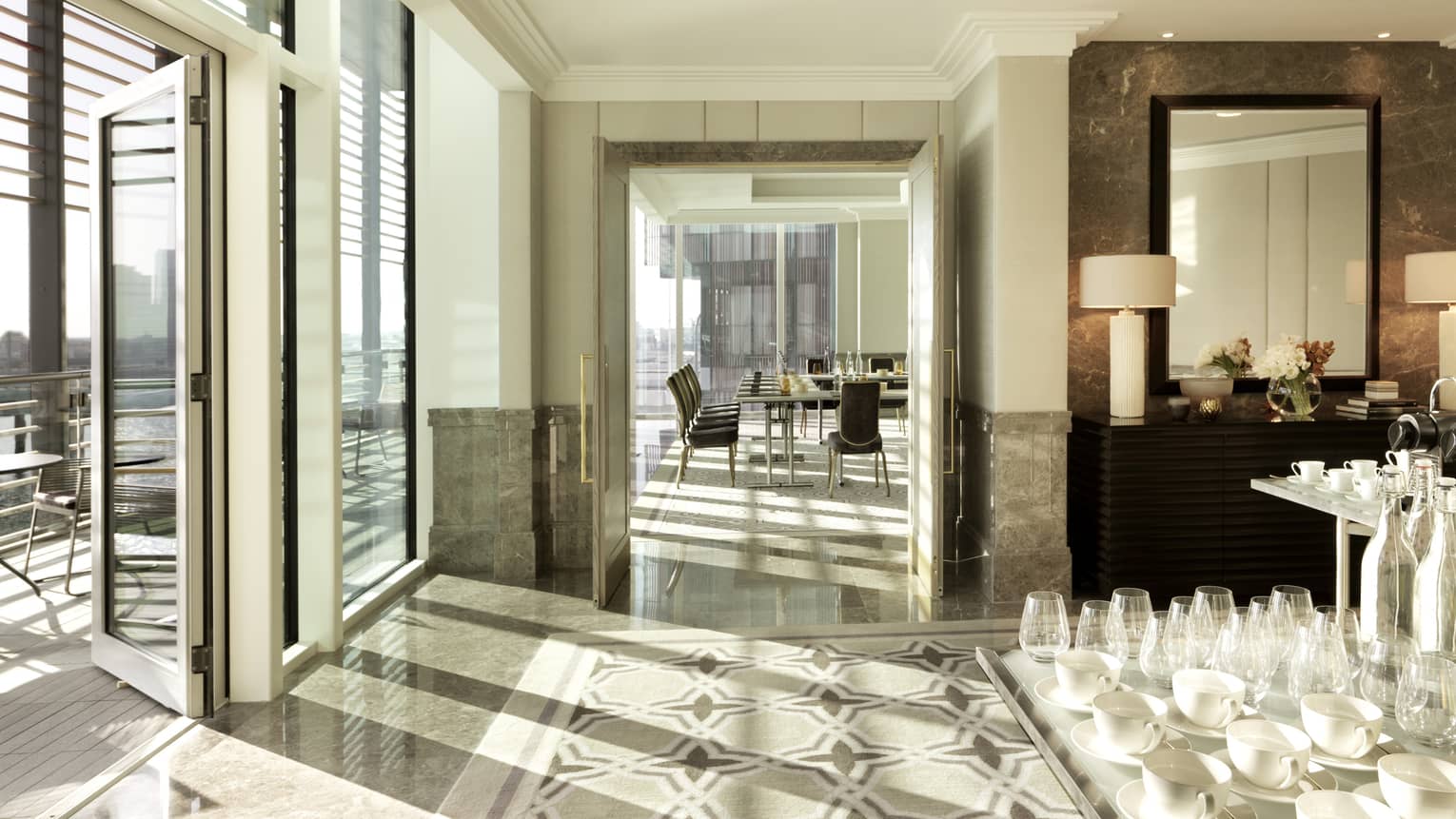 Sun streams into bright Al Fahidi event room near coffee service table, board meeting room 