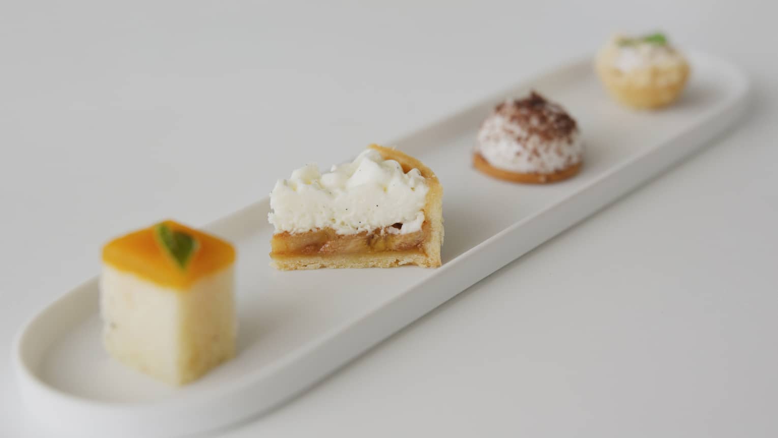 Four Petit Fours on an oval dish