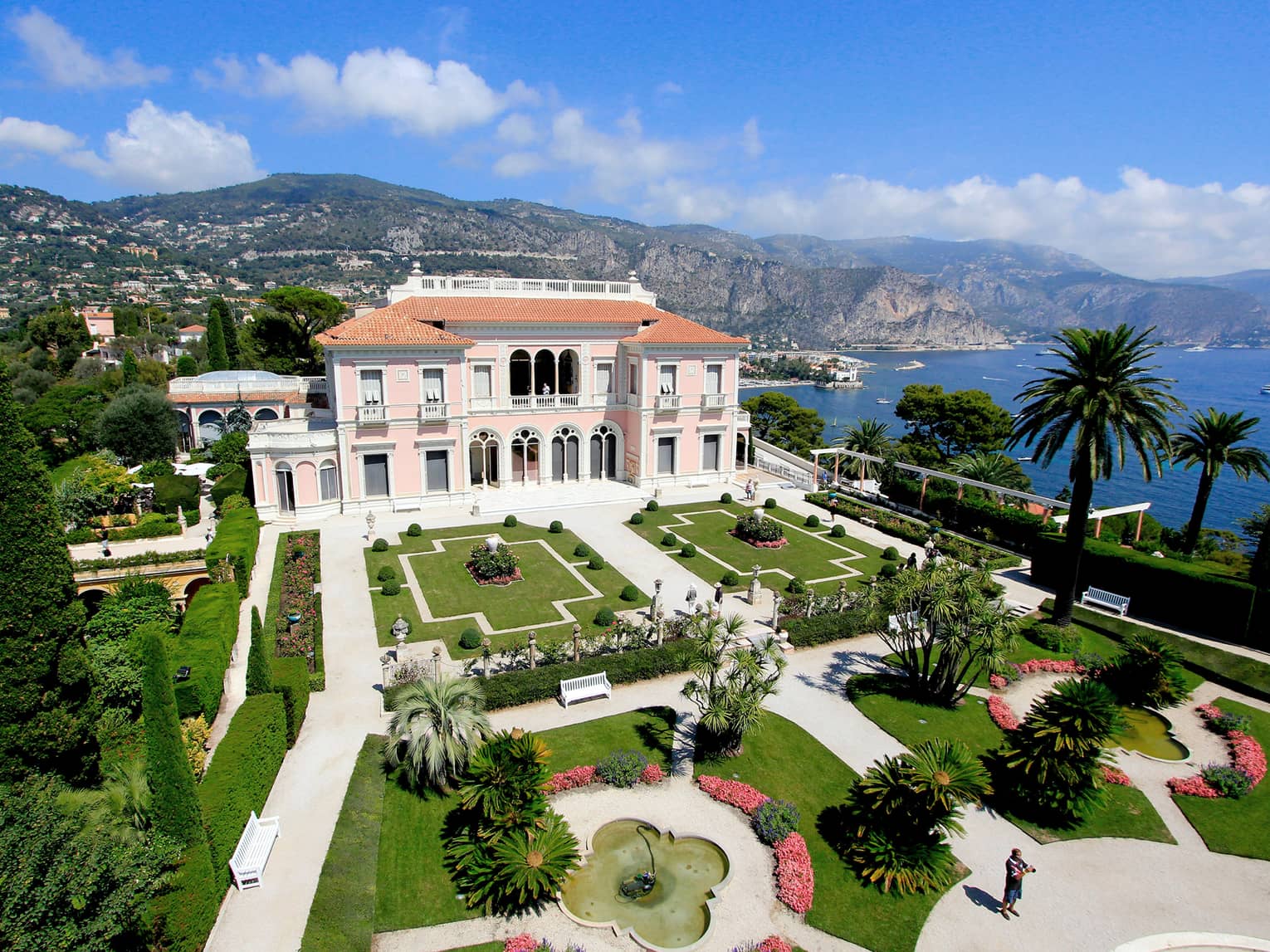 The Grand Hotel, overlooking the water with beautiful arches and pristine gardens