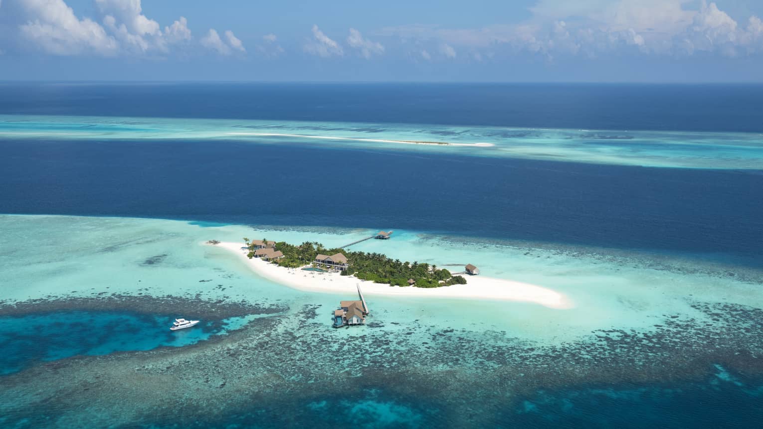 Voavah private island in the bright blue ocean