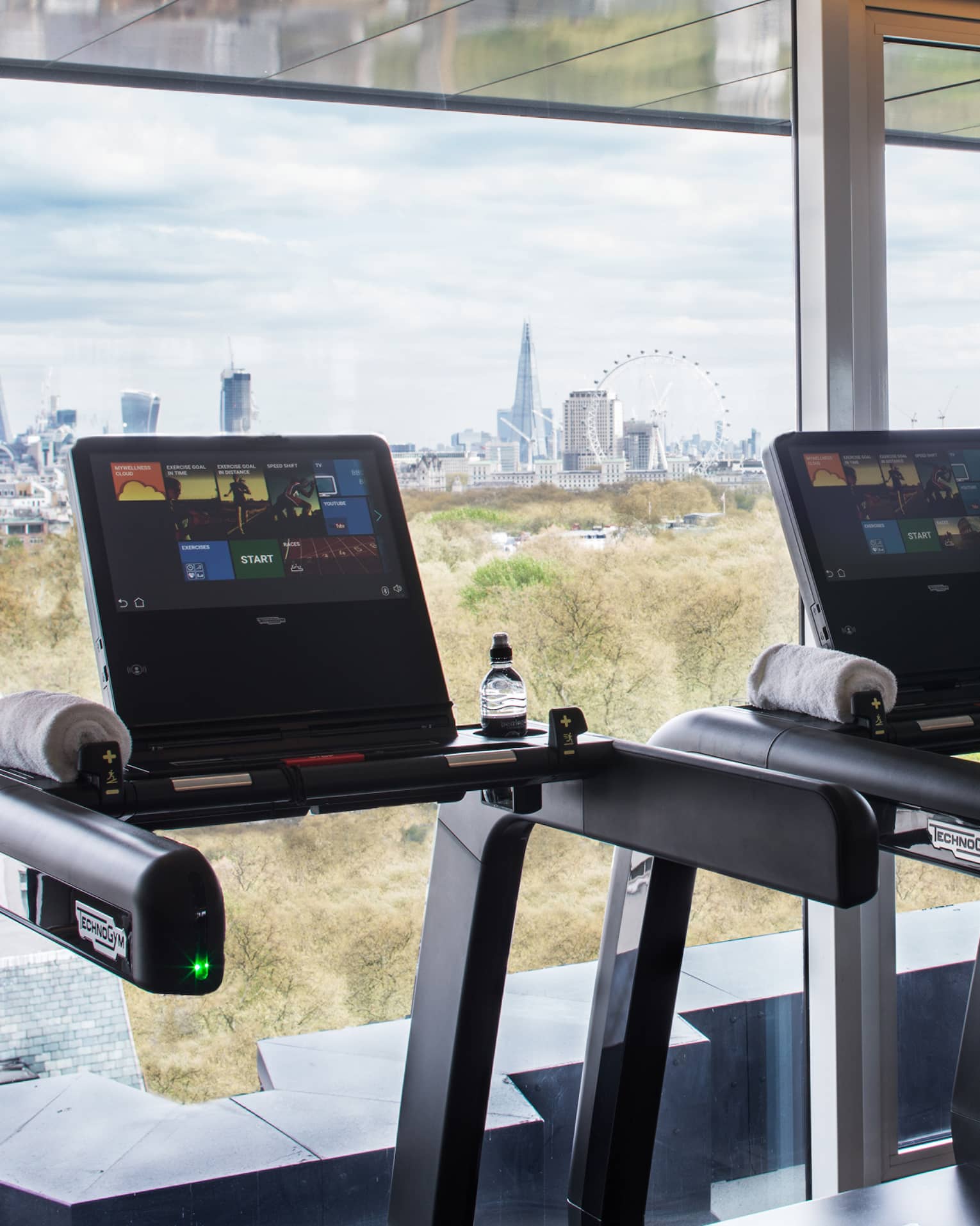 Treadmills along sunny window it Fitness Centre 