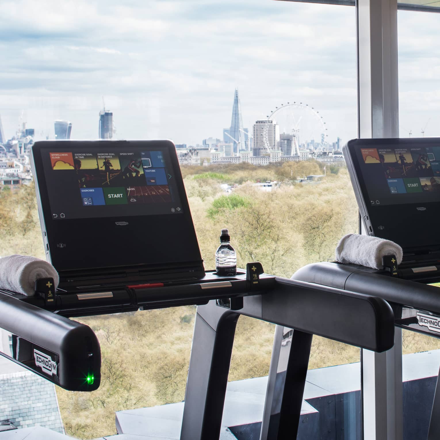 Treadmills along sunny window it Fitness Centre 
