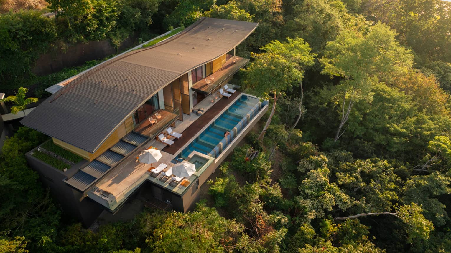 Large private residence with private pool nestled in a green hillside