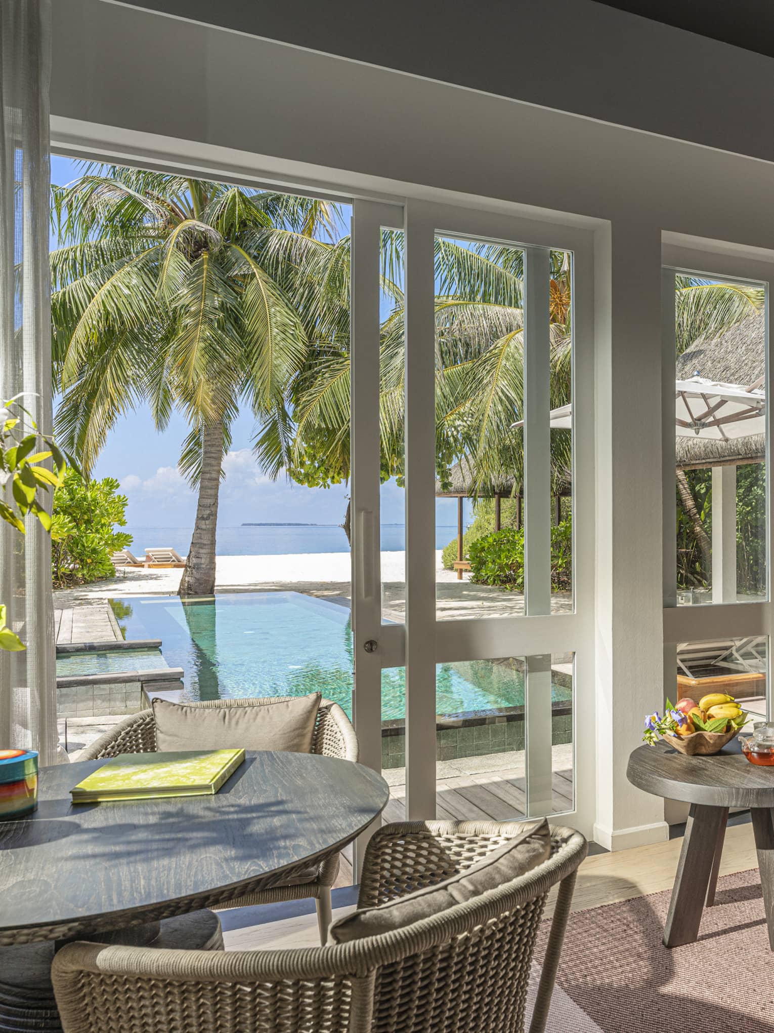 Indoor sitting area and wet bar, leading out to private pool terrace