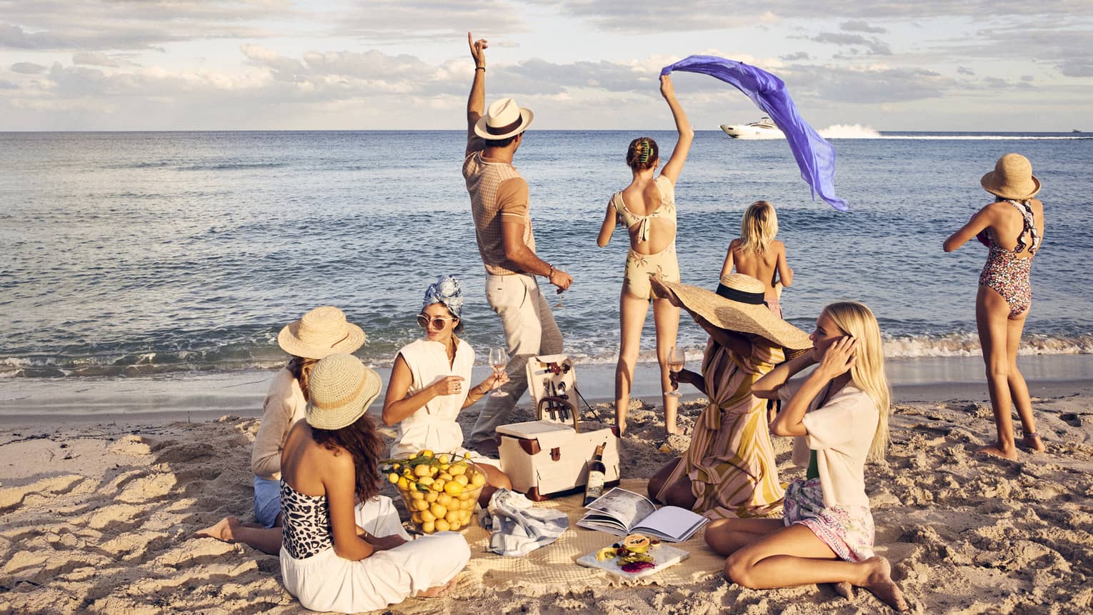 A group of people having a picnic on a beach.
