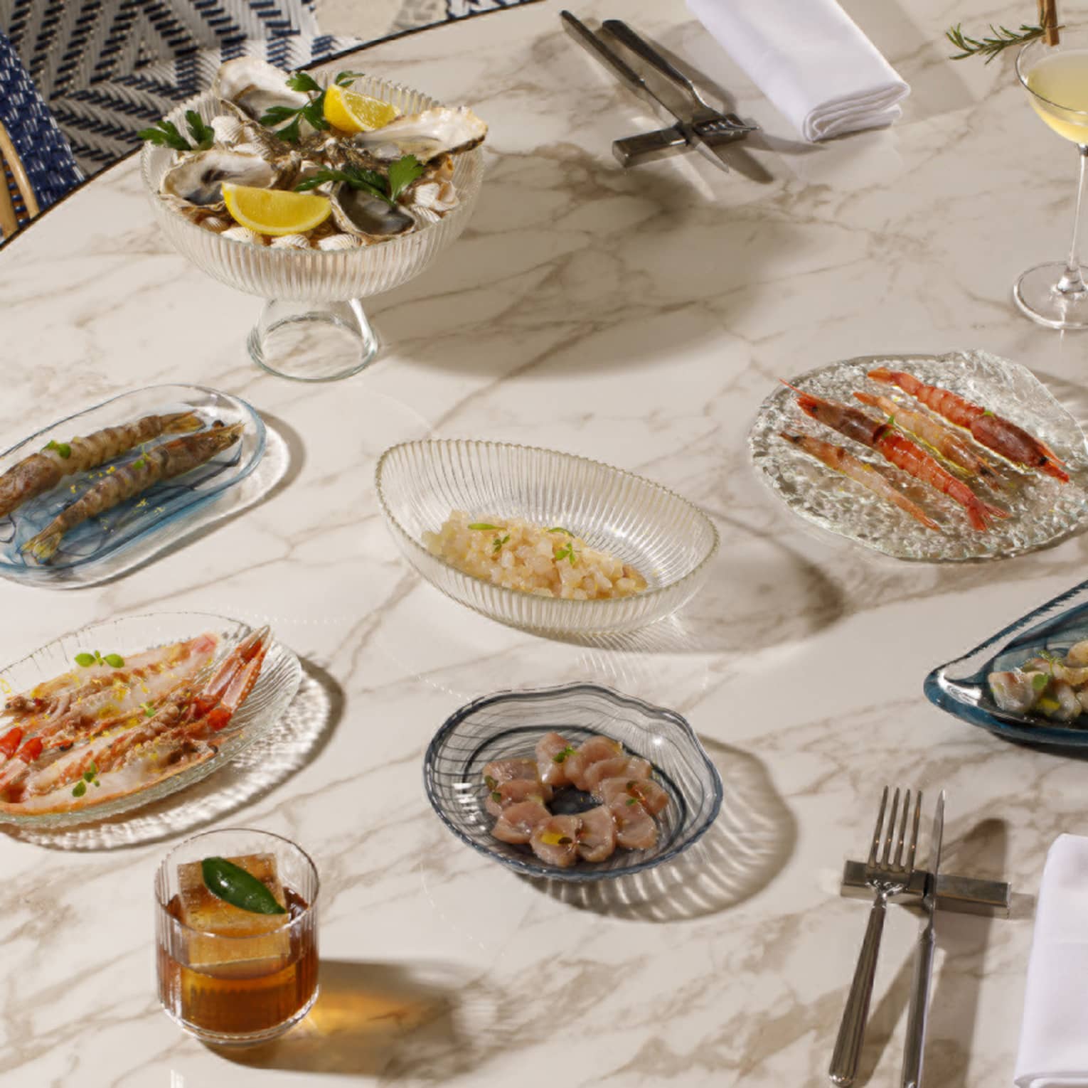 An array of plated food items and drinks set out on a table
