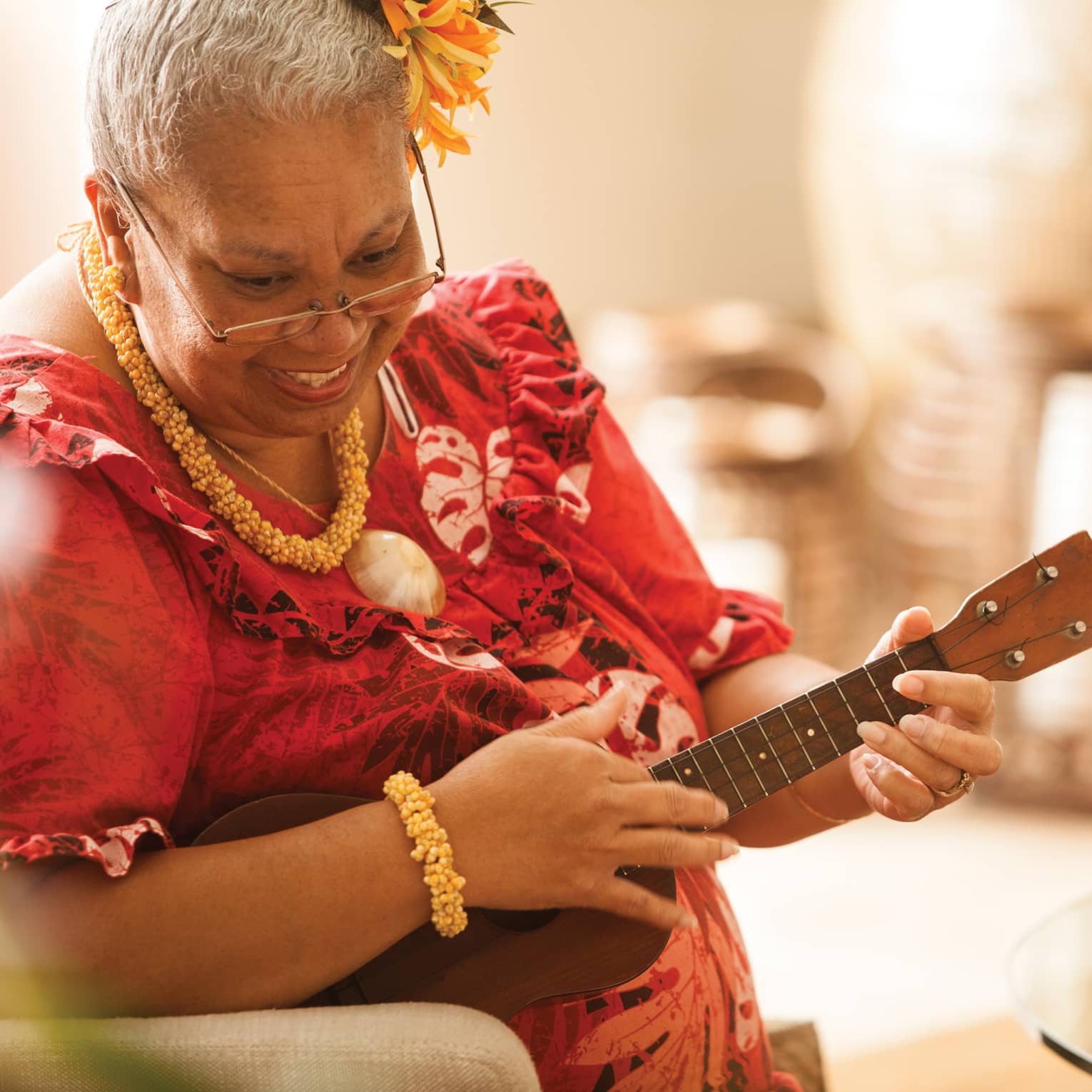Close-up of Hawaiian elder playing ukulele