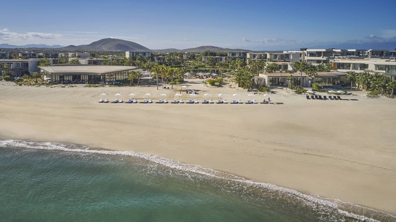 Beach with resort chair setup at Four Seasons Resort Los Cabos