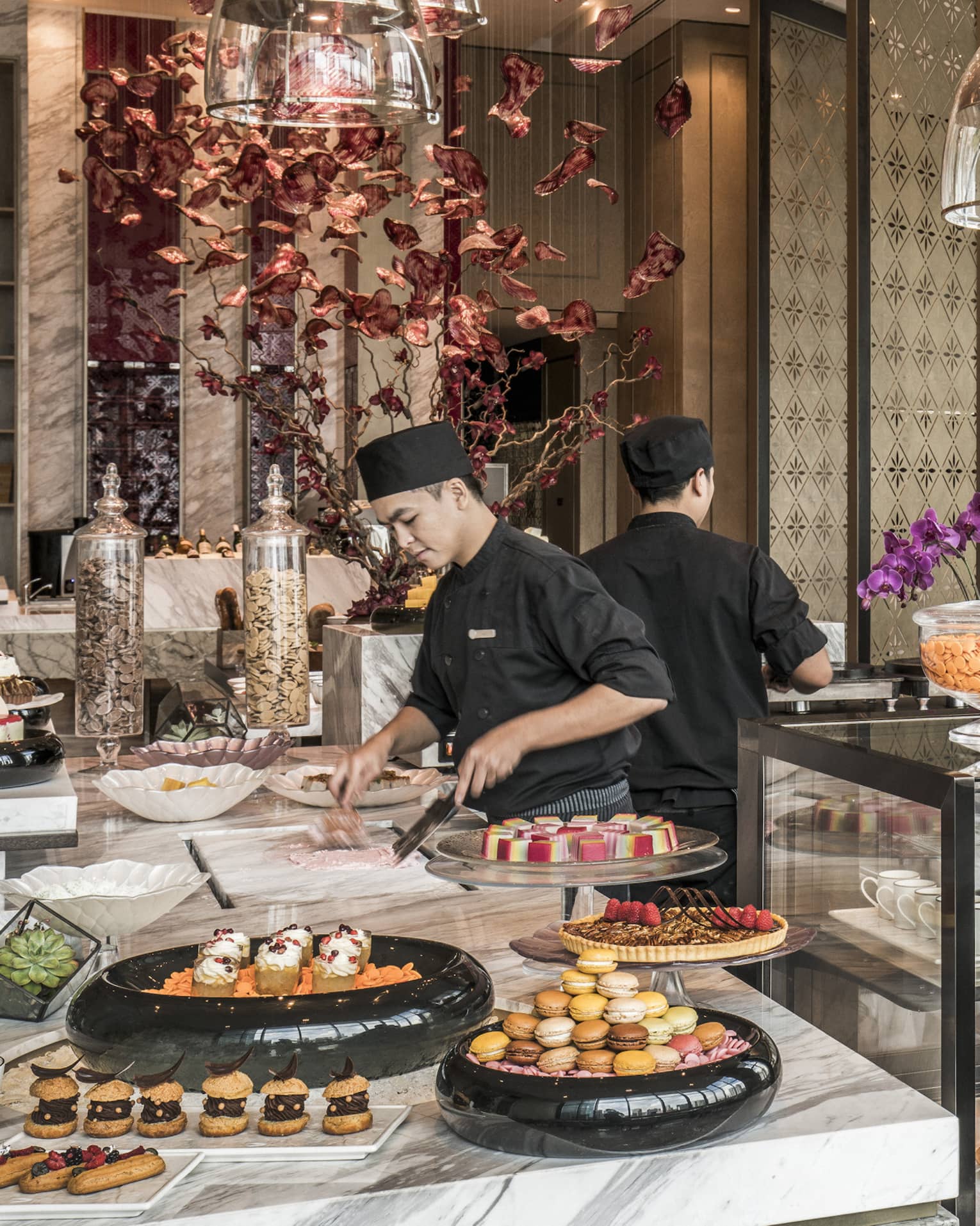 Curate dessert station with two chefs making treats