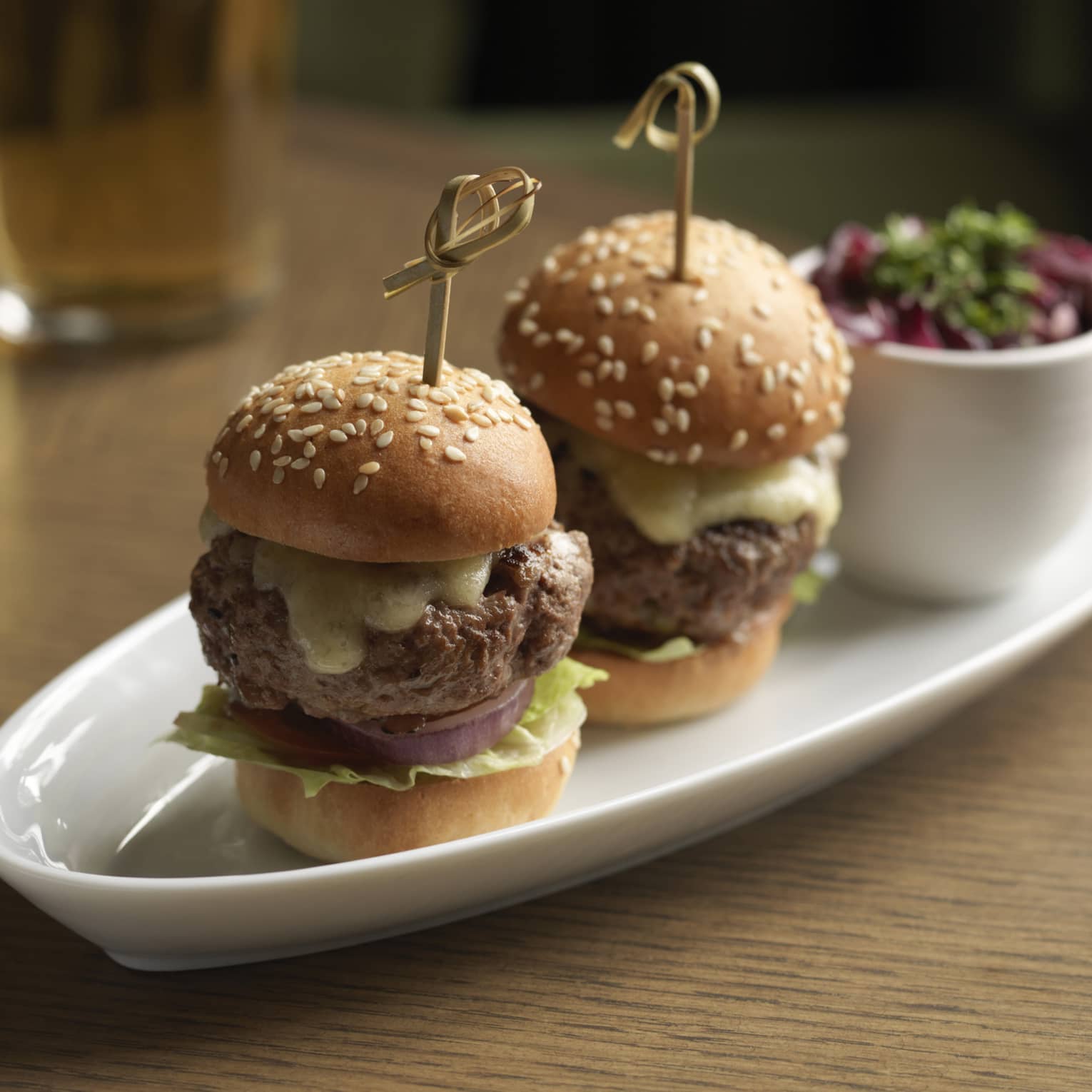 Two Kobe beef sliders served with kimchi slaw and smoked Gouda