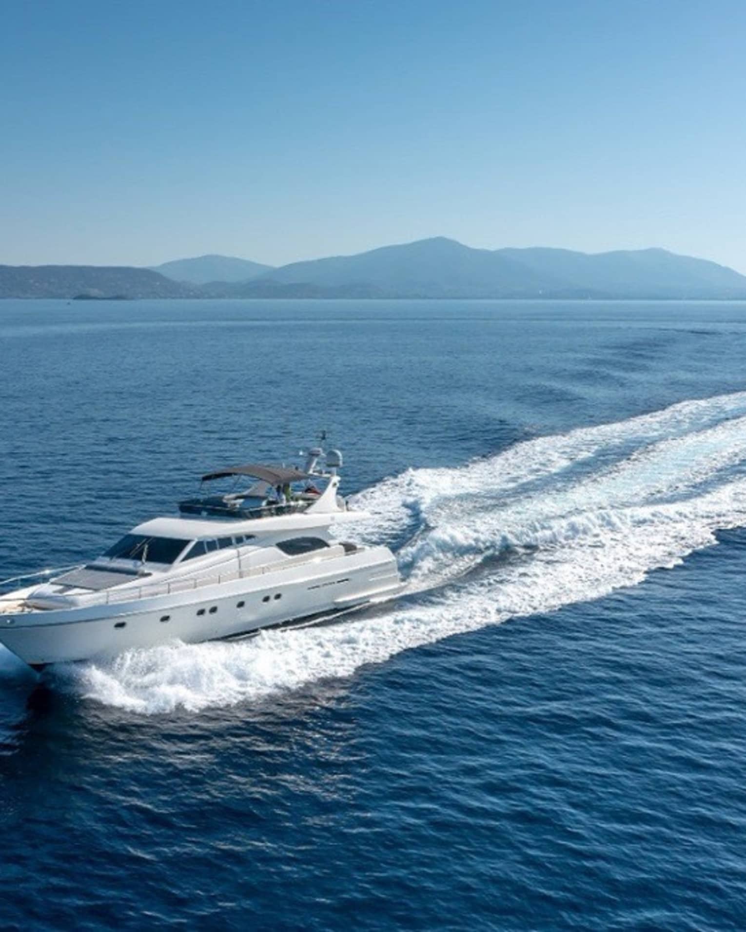 Yacht cruising crystal-blue waters