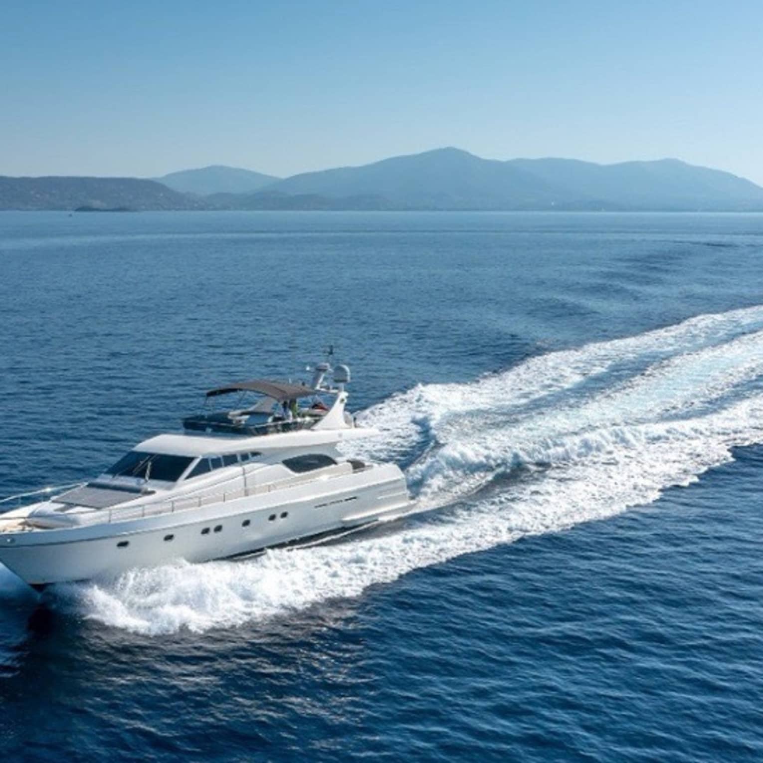 Yacht cruising crystal-blue waters