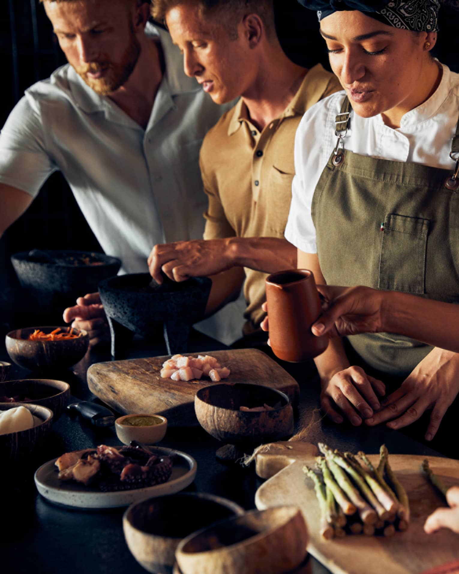 A group of people cooking food.