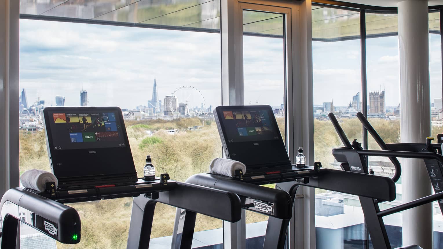 Treadmills along sunny window it Fitness Centre 