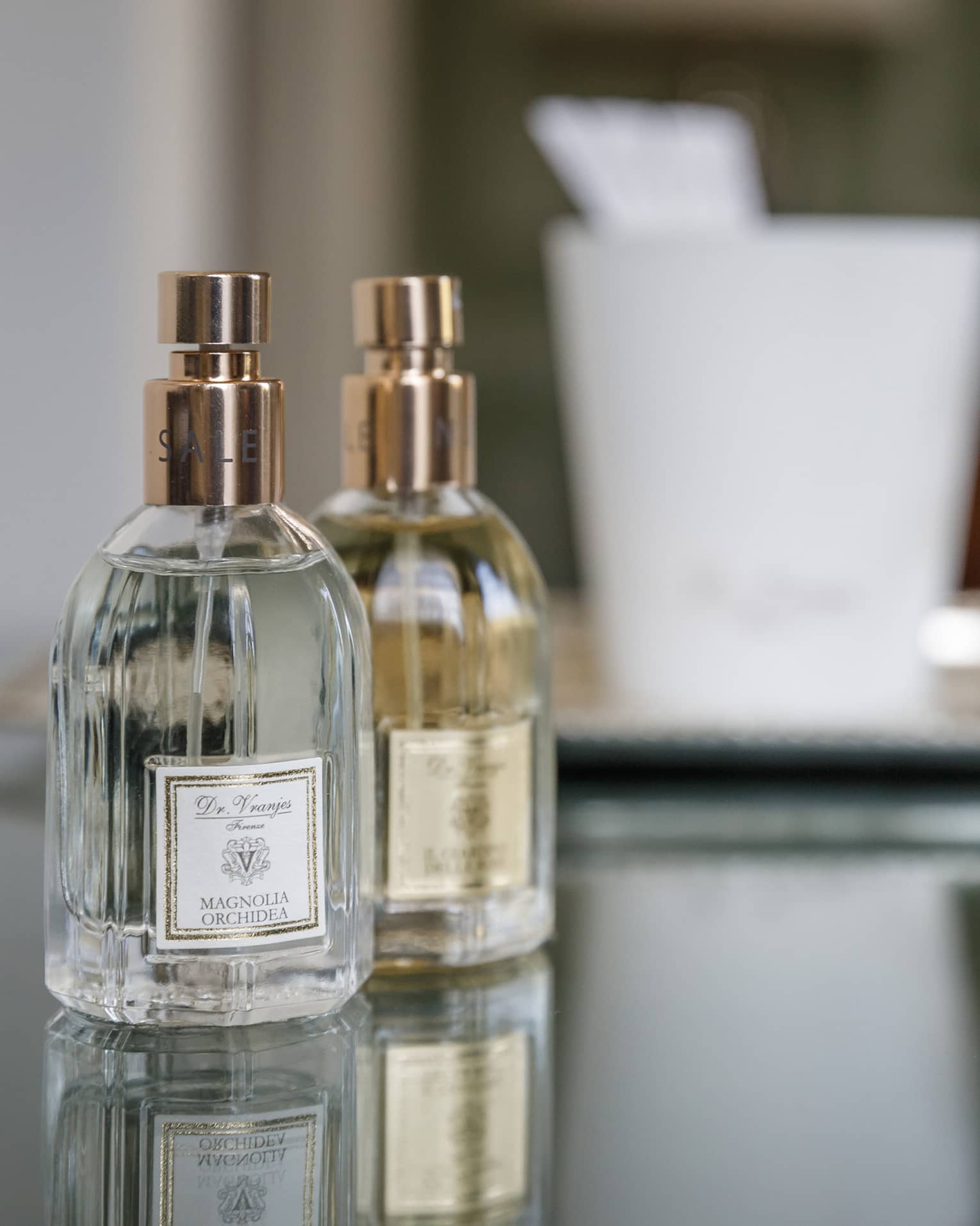 Two small spray perfume bottles