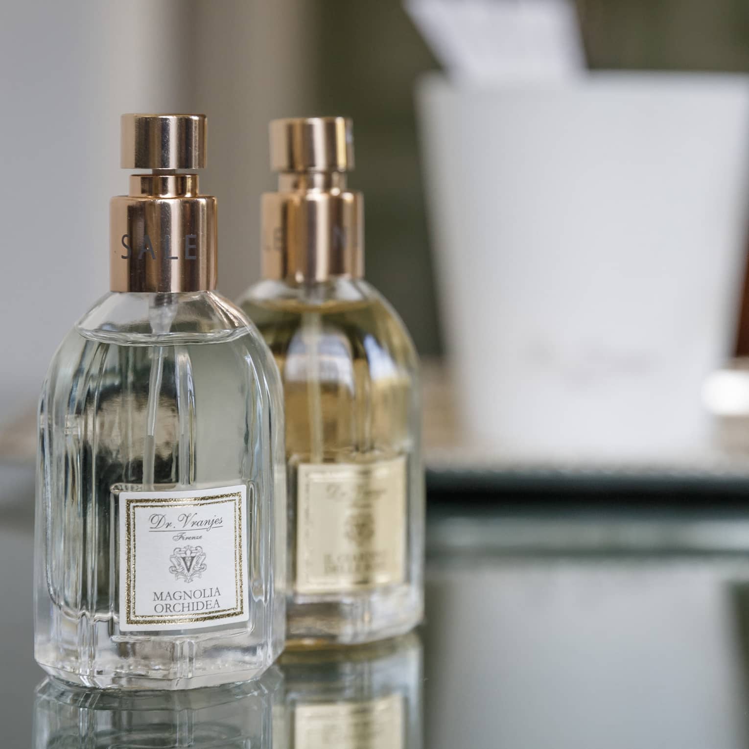 Two small spray perfume bottles