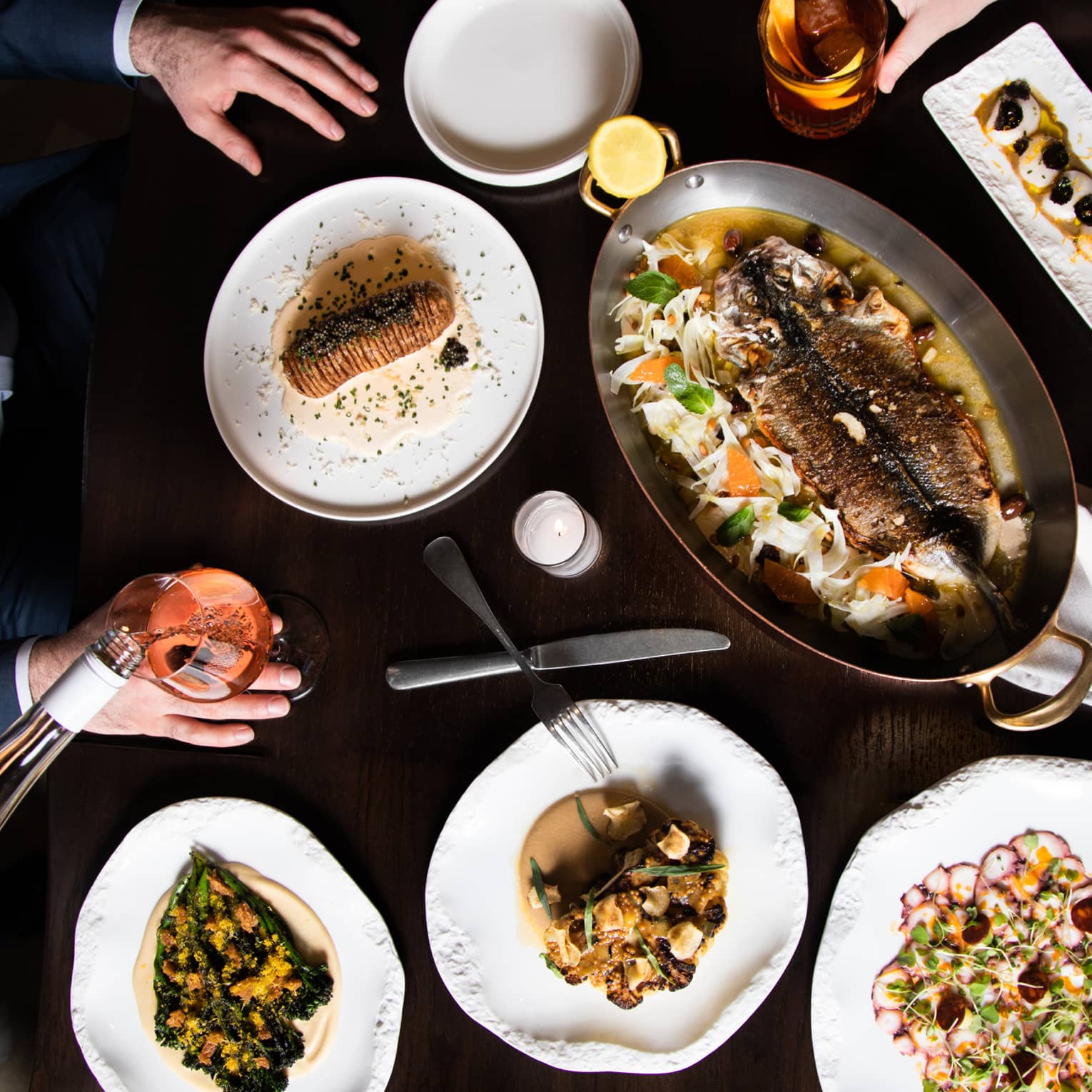An assortment seafood on white plates.
