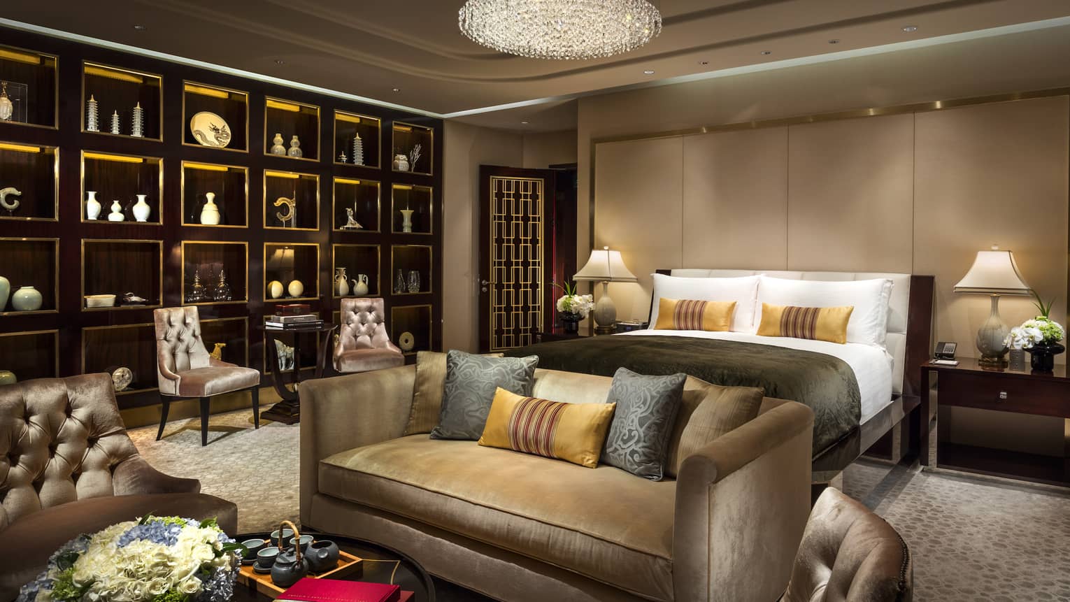 The Imperial Suite’s opulent bedroom, including a full living area and a wall of art works.