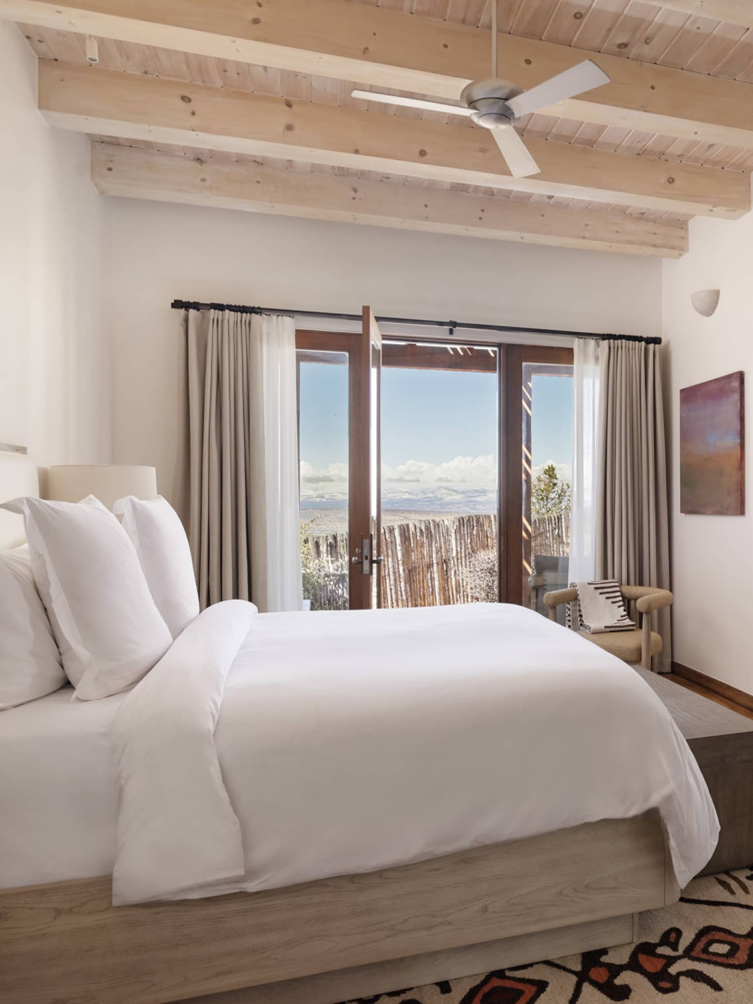 Suite bedroom with king bed at Four Seasons Resort Santa Fe
