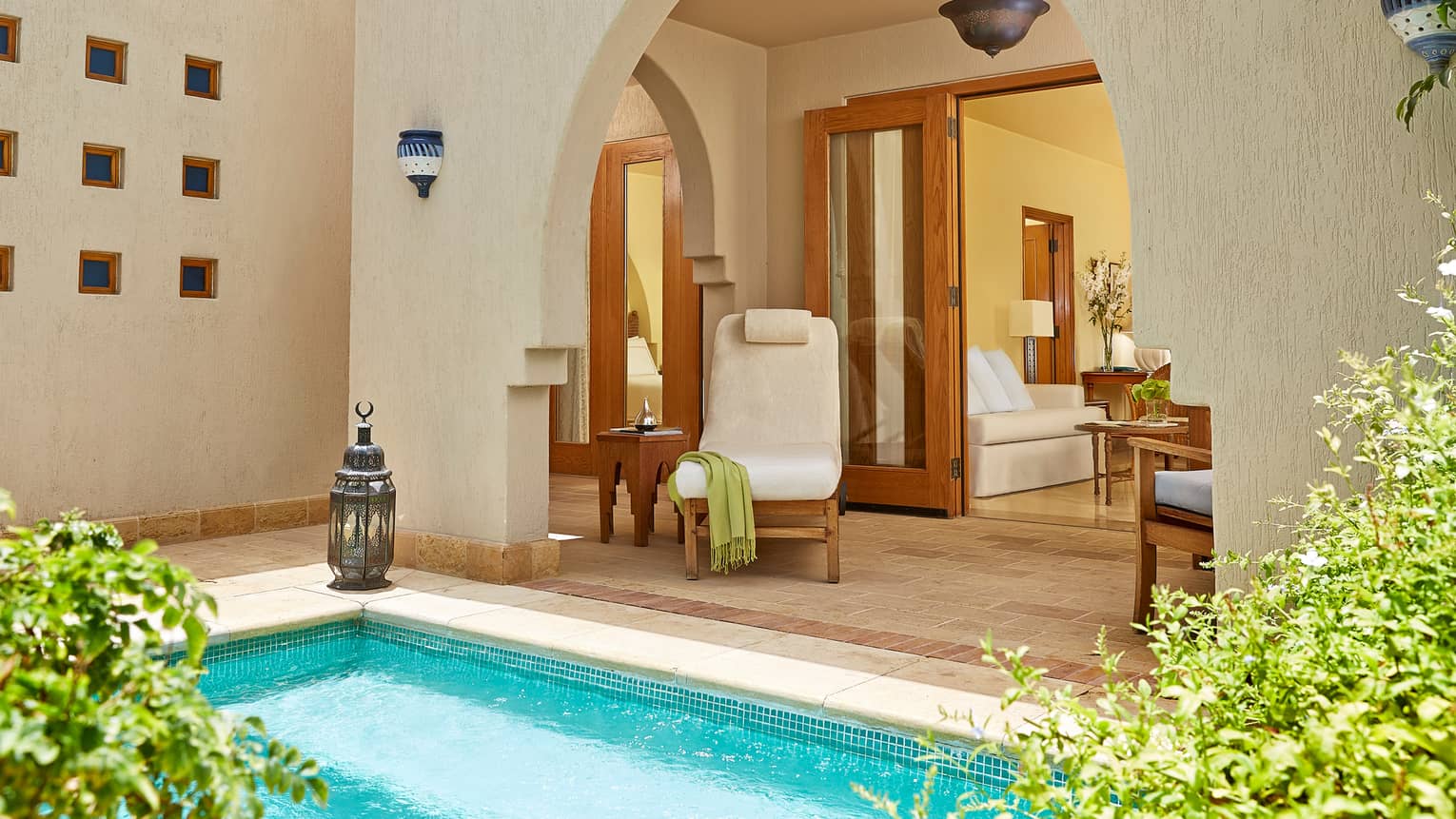 One-Bedroom Suite With Plunge Pool, plush pool chair by corner of turquoise swimming pool
