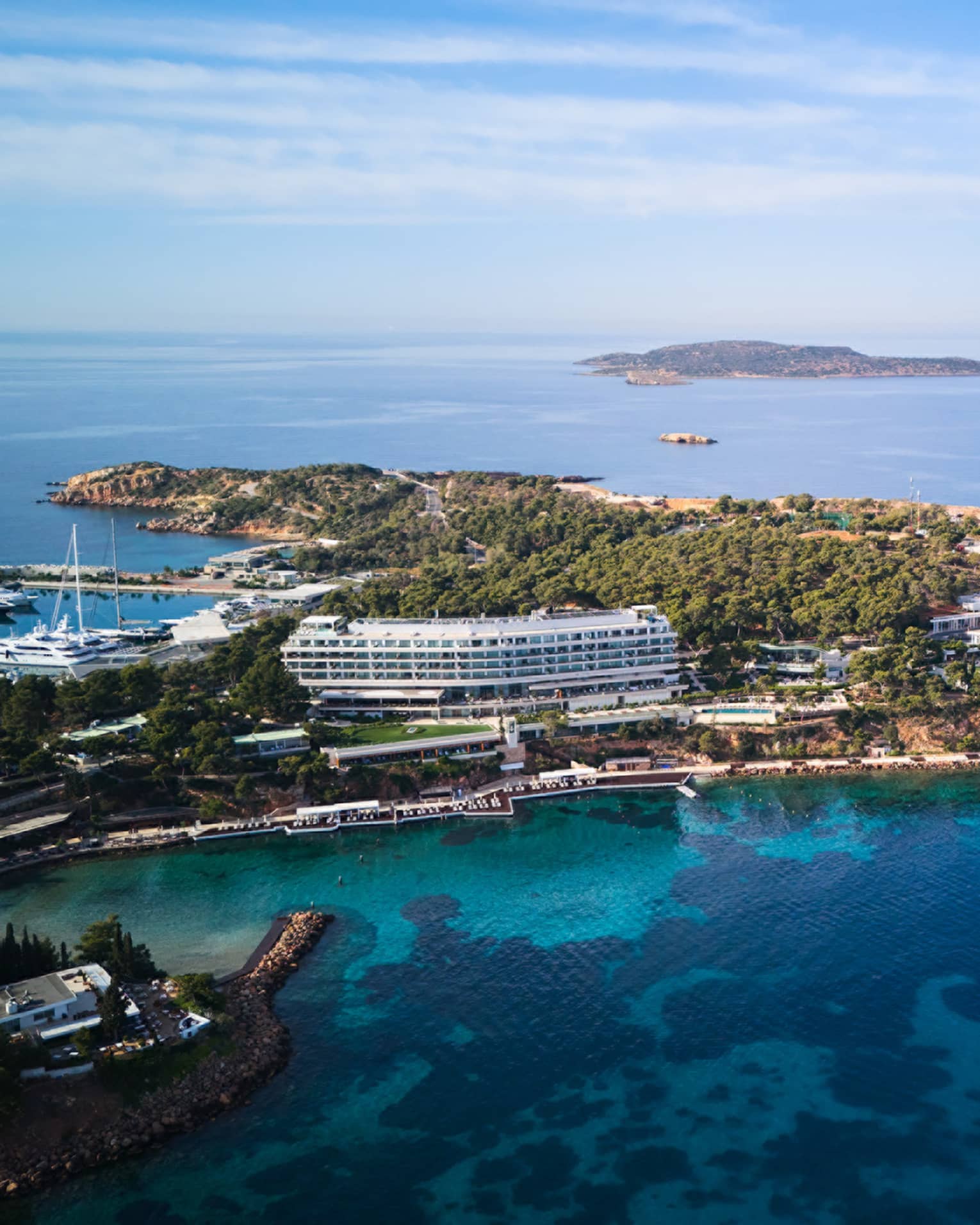 Aerial view of resort on a peninsula surrounded by blue sea