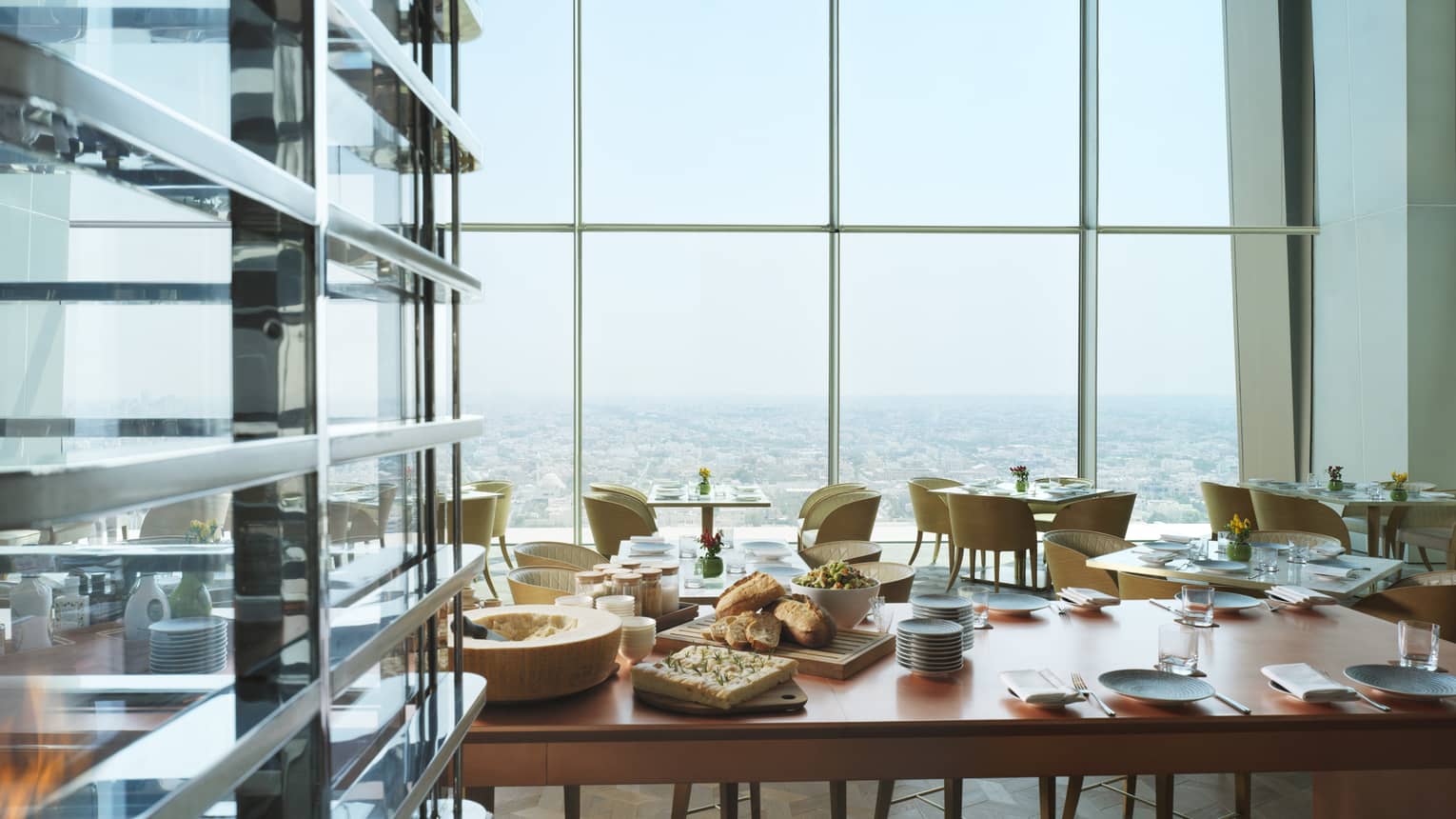 Table laid with food in rooftop restaurant overlooking Kuwait 