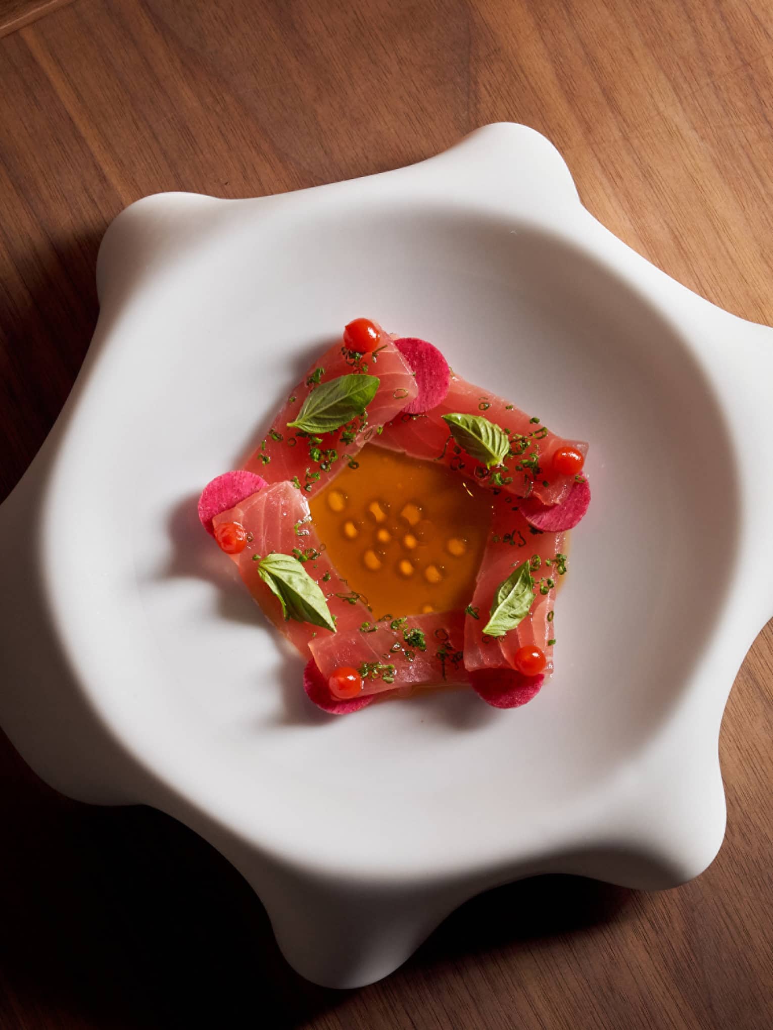 Slices of sashimion a white dish