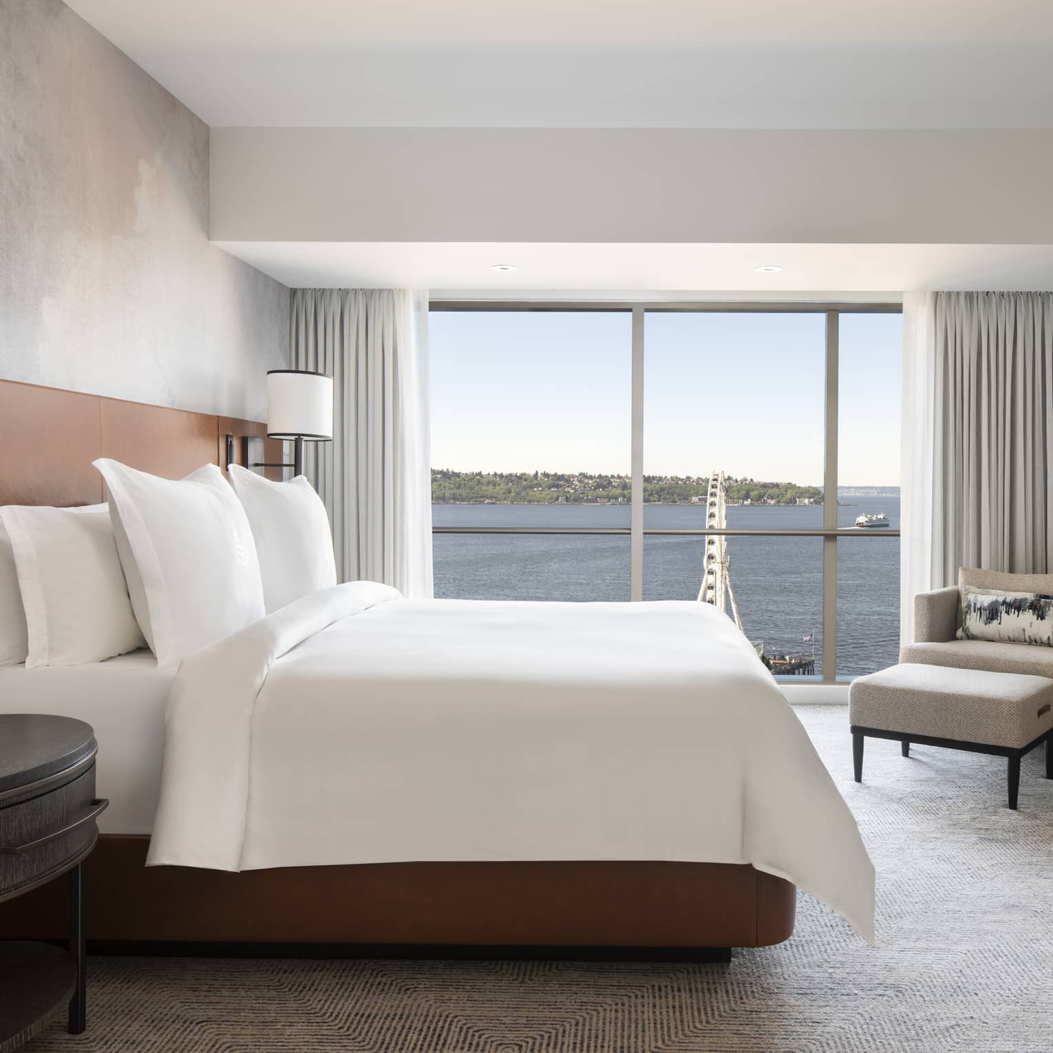 The Deluxe Elliot Bay Suite overlooks the Seattle Great Wheel