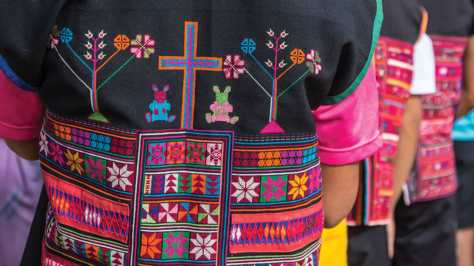 Close-up of colourful textiles on clothing made by hill tribes