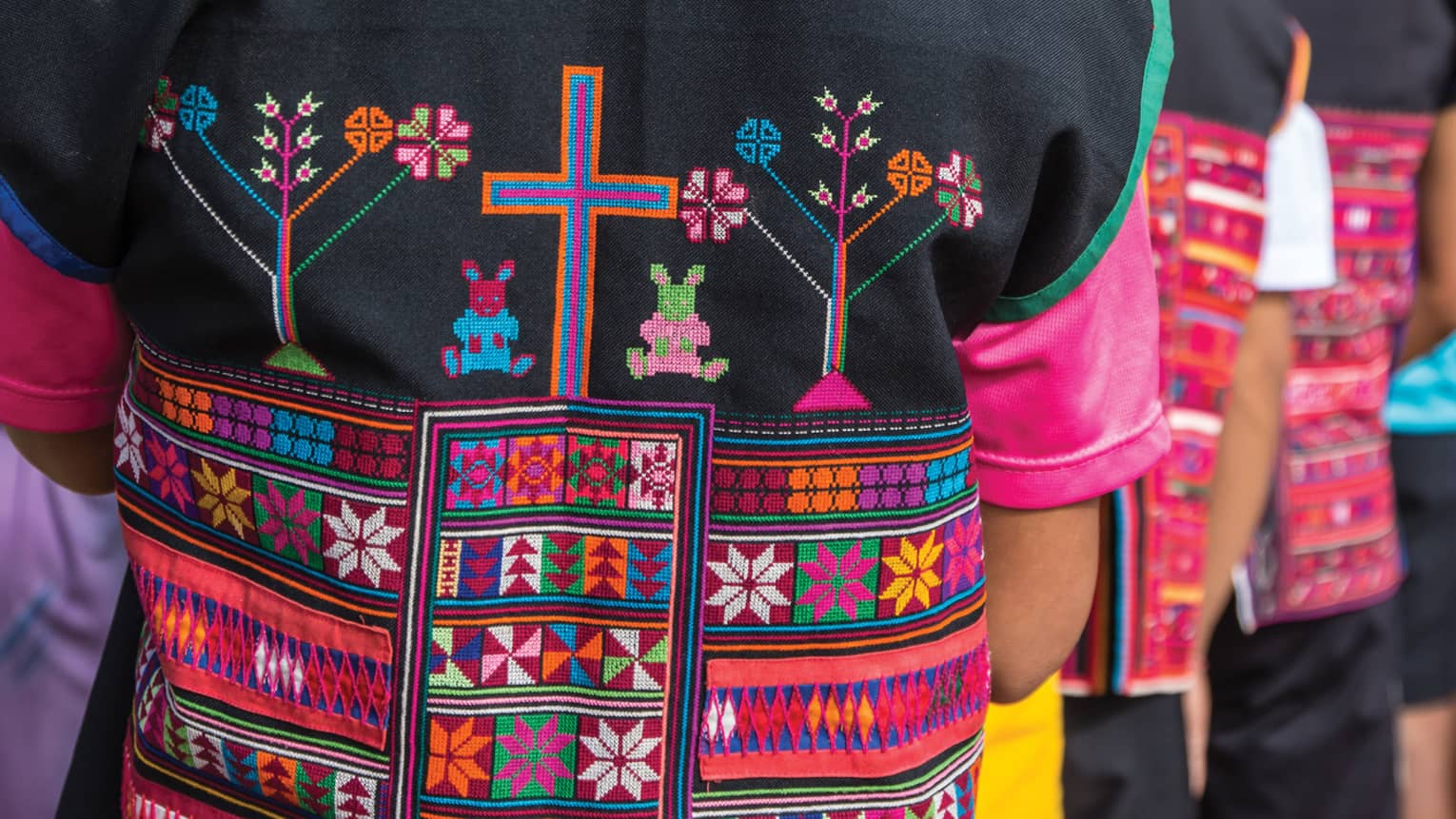 Close-up of colourful textiles on clothing made by hill tribes