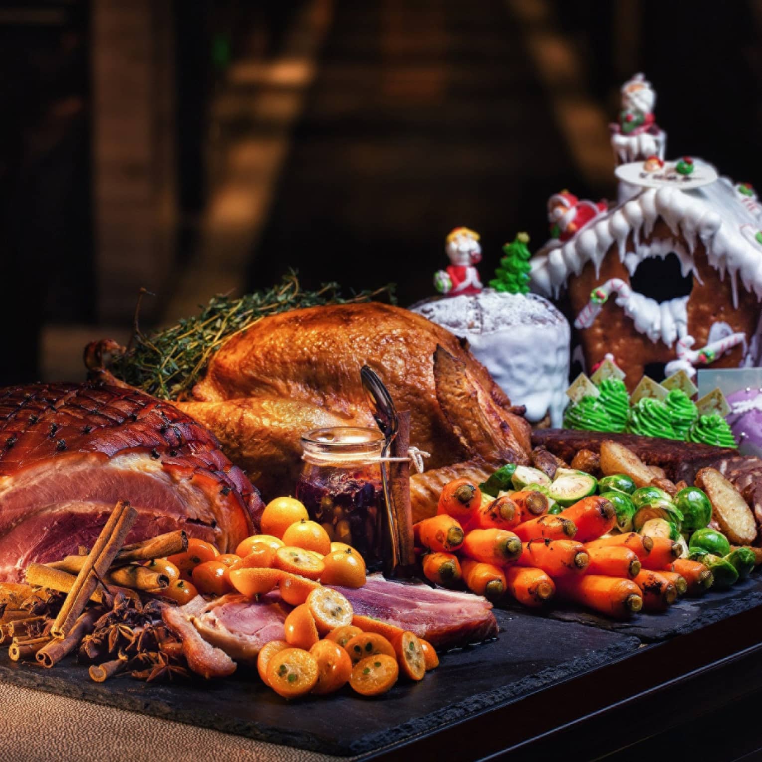 Christmas dinner with turkey and vegetables with gingerbread house on the side