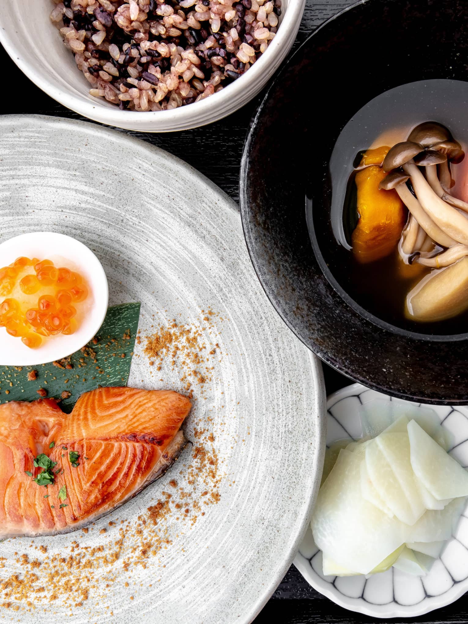 Aerial view of traditional Nourish spread, including salmon, sweet potato and mushroom soup