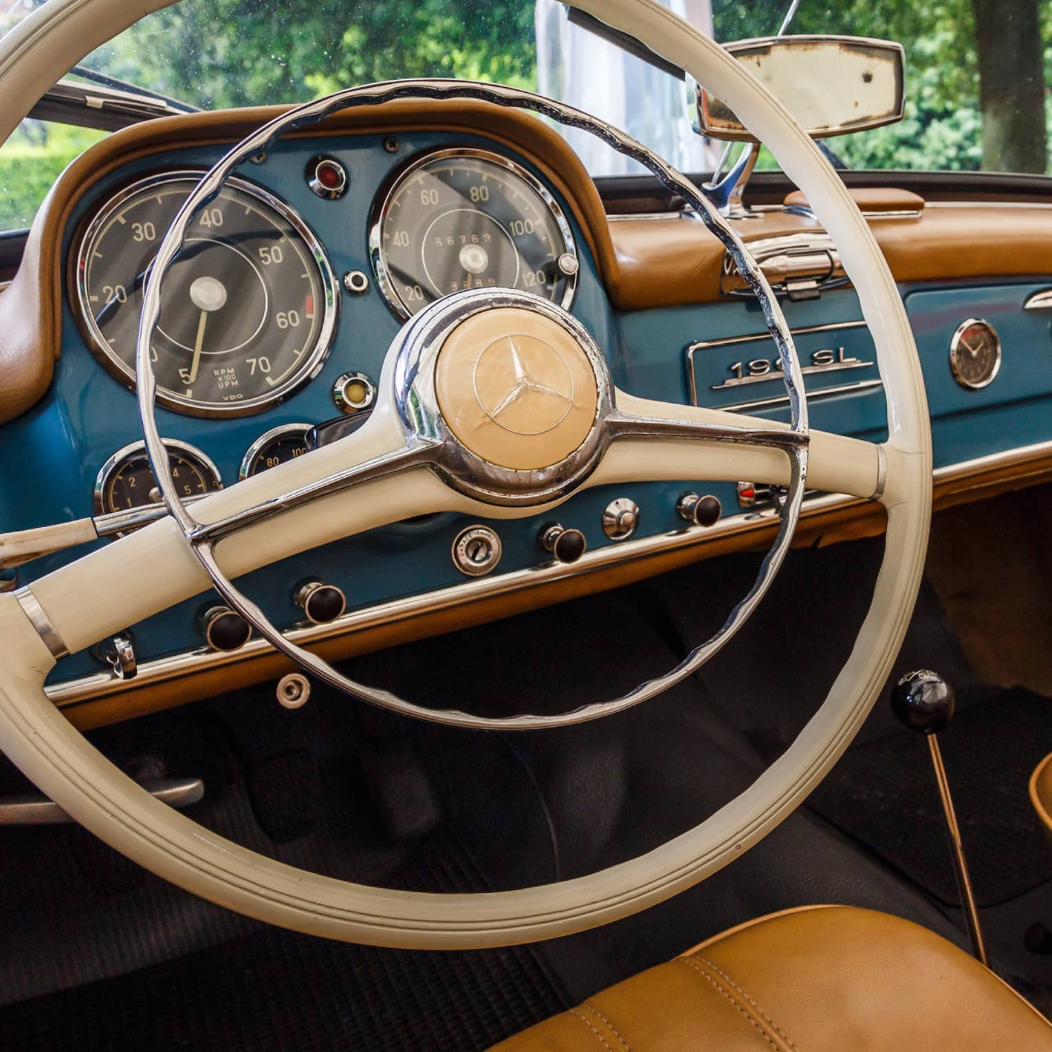 Wheel, dashboard, leather seats of classic luxury car